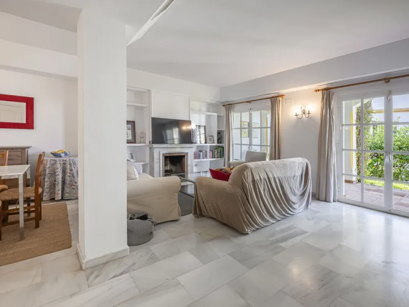This stunning semi-detached villa is located in a traditional Andalusian development on the New Golden Mile. It is ideally located a short drive from Puerto Banús, with the beach just a short walk away.