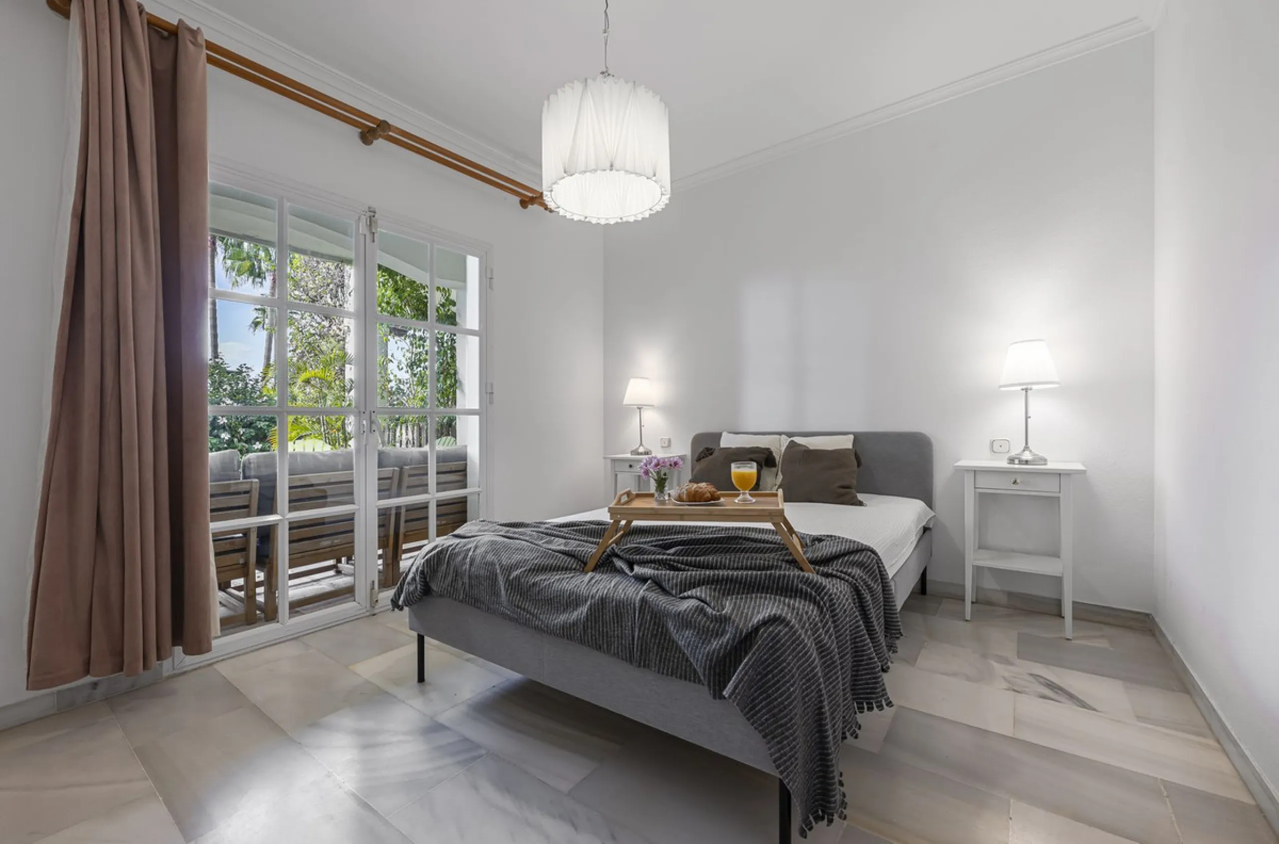This stunning semi-detached villa is located in a traditional Andalusian development on the New Golden Mile. It is ideally located a short drive from Puerto Banús, with the beach just a short walk away.