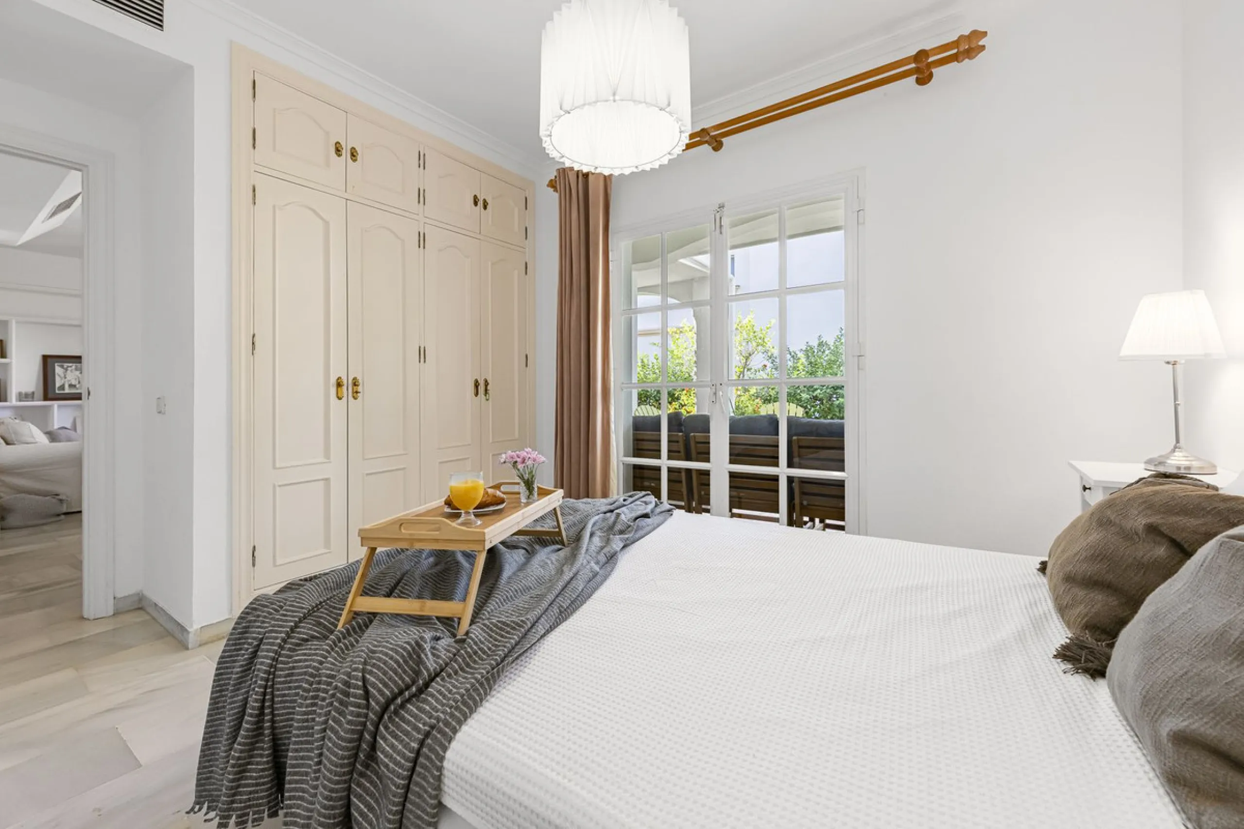 This stunning semi-detached villa is located in a traditional Andalusian development on the New Golden Mile. It is ideally located a short drive from Puerto Banús, with the beach just a short walk away.