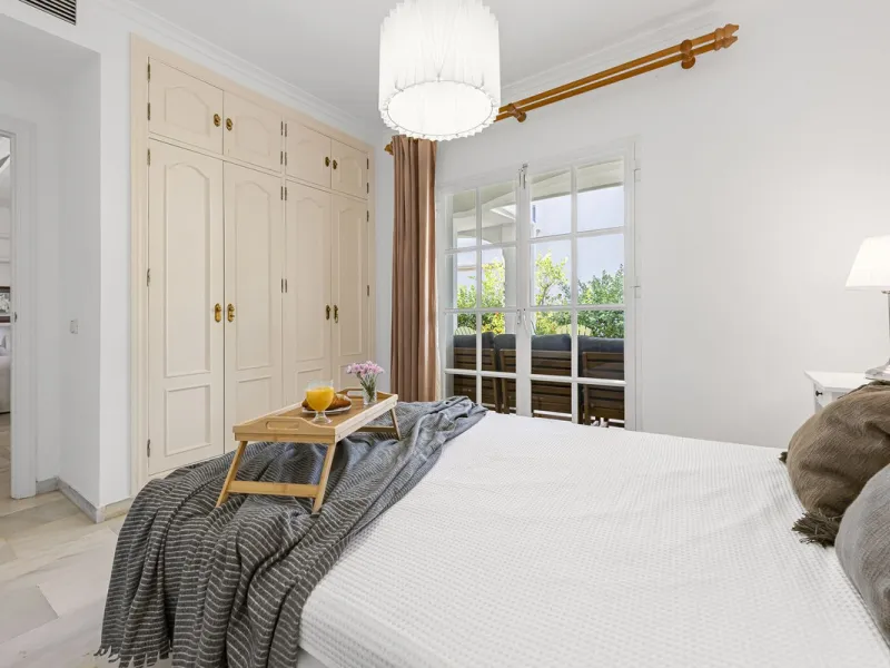 This stunning semi-detached villa is located in a traditional Andalusian development on the New Golden Mile. It is ideally located a short drive from Puerto Banús, with the beach just a short walk away.