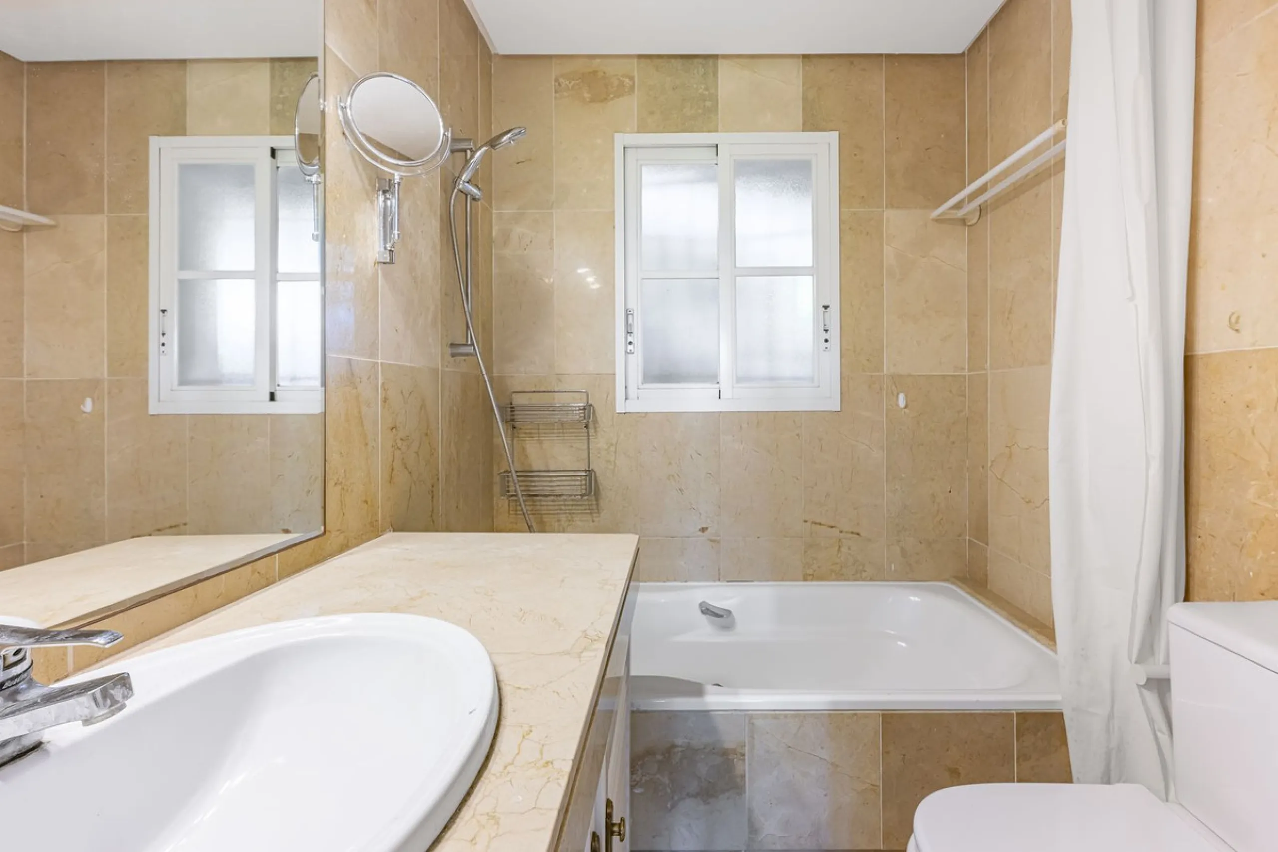 This stunning semi-detached villa is located in a traditional Andalusian development on the New Golden Mile. It is ideally located a short drive from Puerto Banús, with the beach just a short walk away.
