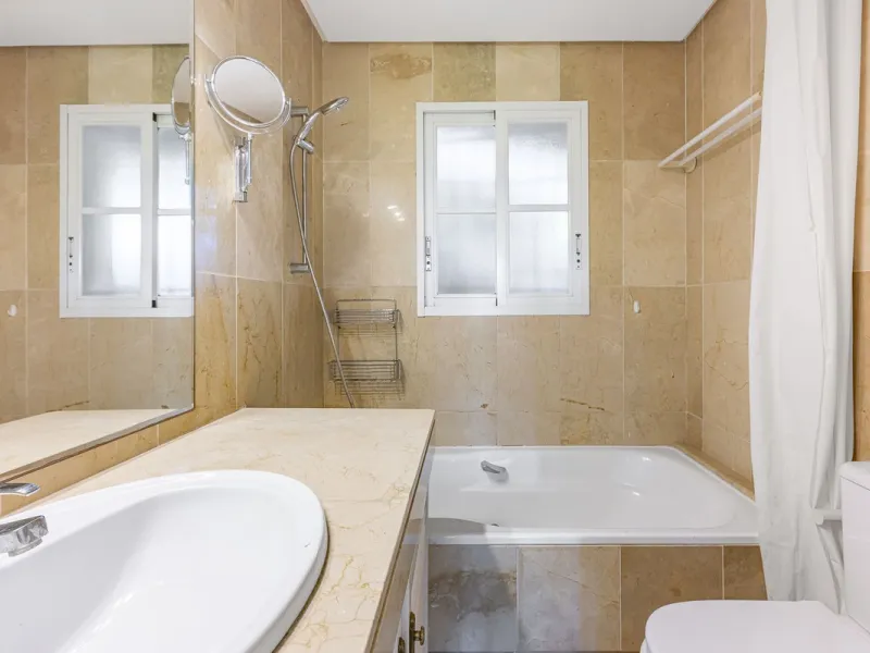 This stunning semi-detached villa is located in a traditional Andalusian development on the New Golden Mile. It is ideally located a short drive from Puerto Banús, with the beach just a short walk away.