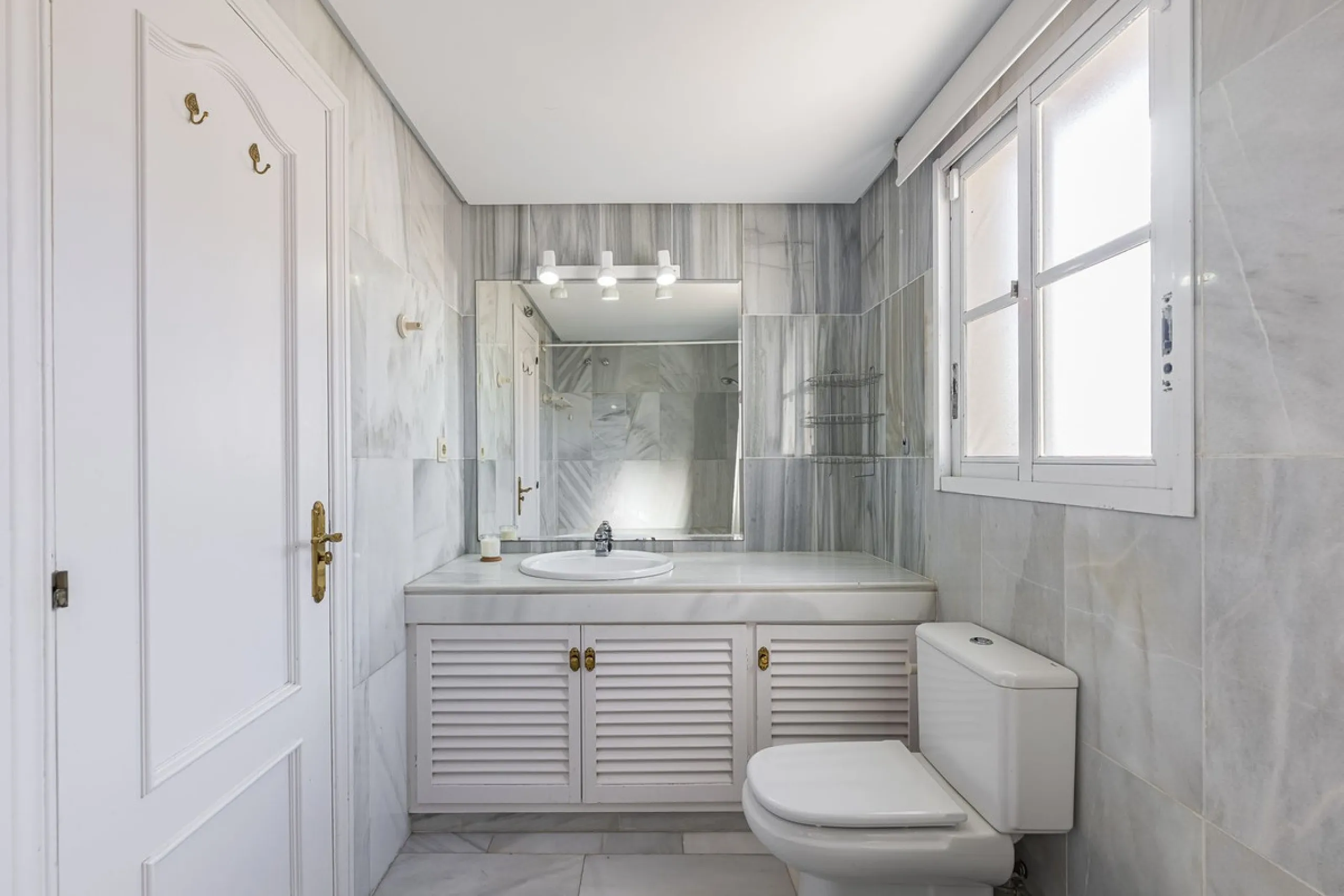 This stunning semi-detached villa is located in a traditional Andalusian development on the New Golden Mile. It is ideally located a short drive from Puerto Banús, with the beach just a short walk away.