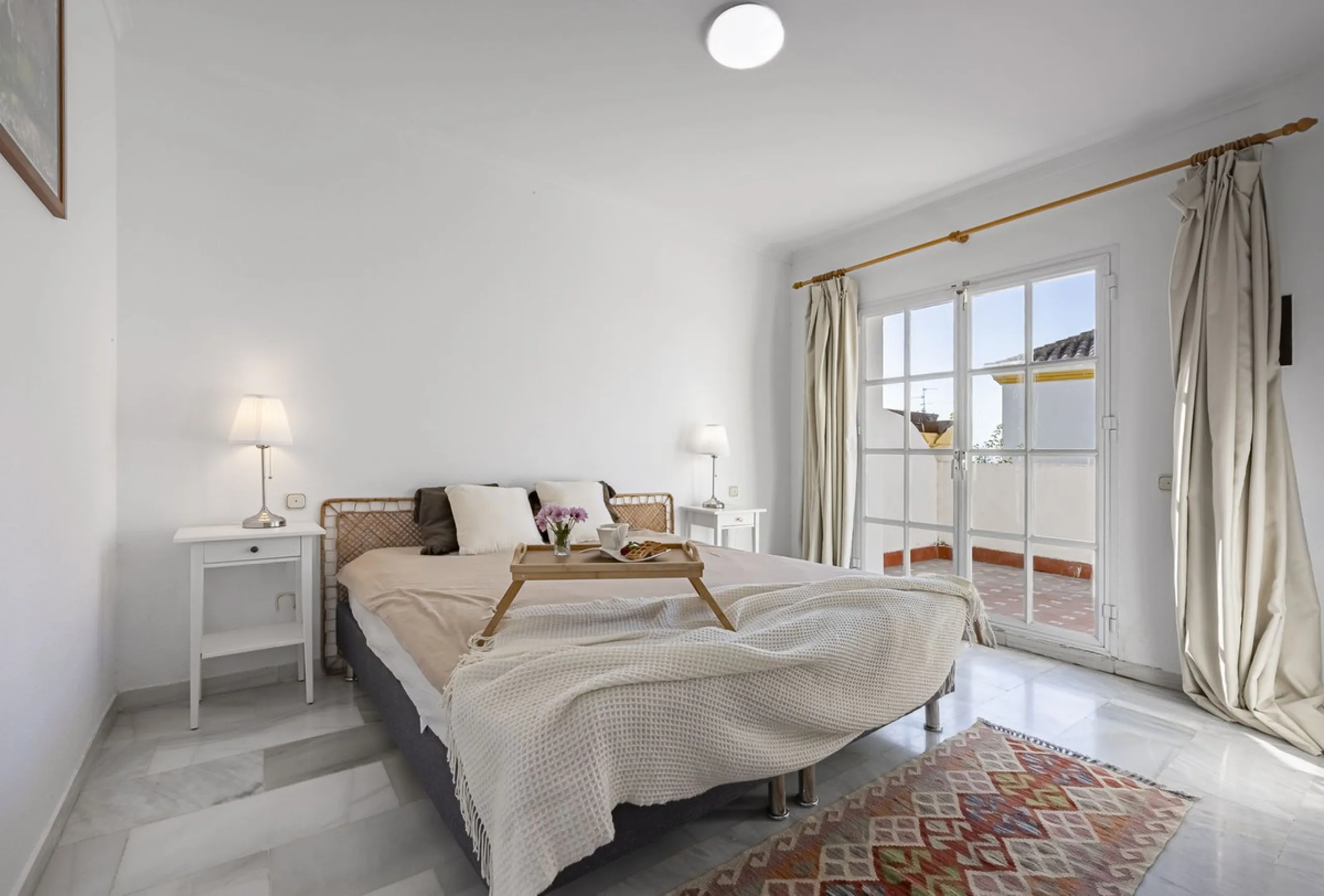 This stunning semi-detached villa is located in a traditional Andalusian development on the New Golden Mile. It is ideally located a short drive from Puerto Banús, with the beach just a short walk away.