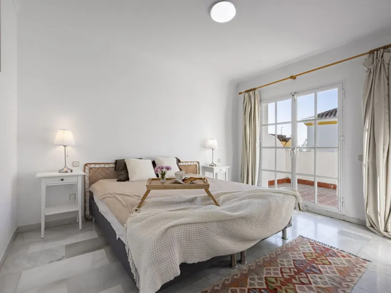 This stunning semi-detached villa is located in a traditional Andalusian development on the New Golden Mile. It is ideally located a short drive from Puerto Banús, with the beach just a short walk away.