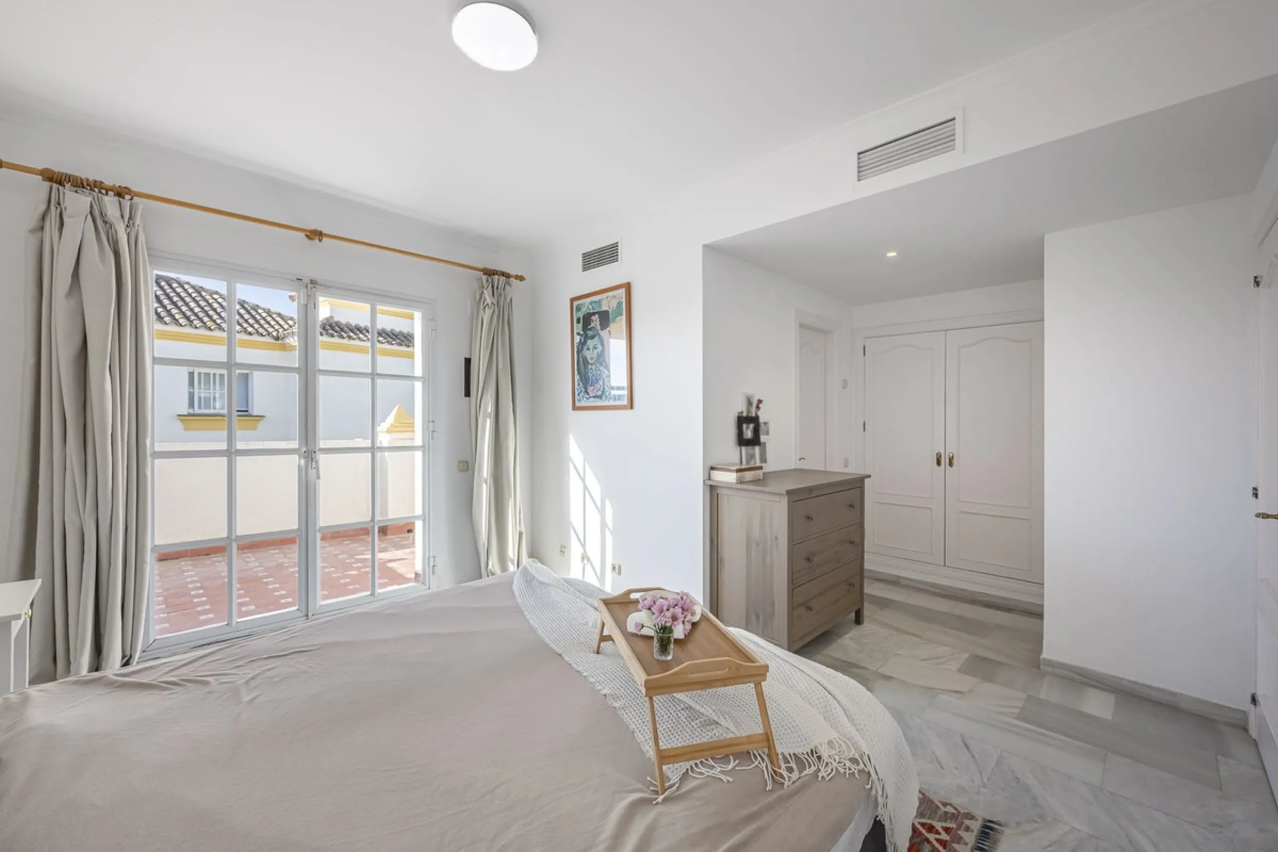 This stunning semi-detached villa is located in a traditional Andalusian development on the New Golden Mile. It is ideally located a short drive from Puerto Banús, with the beach just a short walk away.