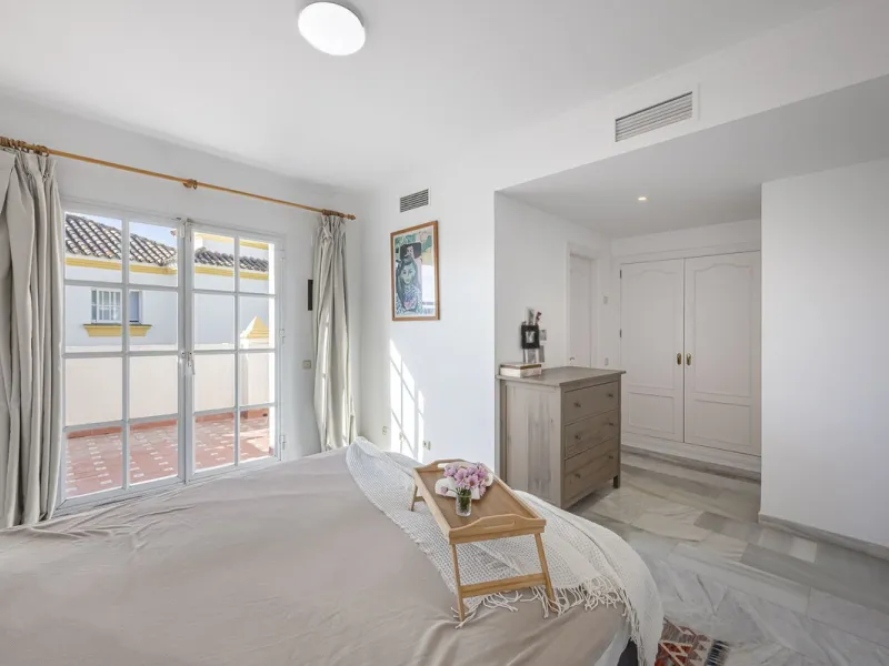 This stunning semi-detached villa is located in a traditional Andalusian development on the New Golden Mile. It is ideally located a short drive from Puerto Banús, with the beach just a short walk away.