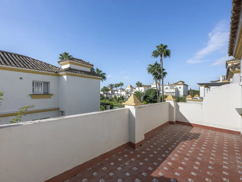 This stunning semi-detached villa is located in a traditional Andalusian development on the New Golden Mile. It is ideally located a short drive from Puerto Banús, with the beach just a short walk away.