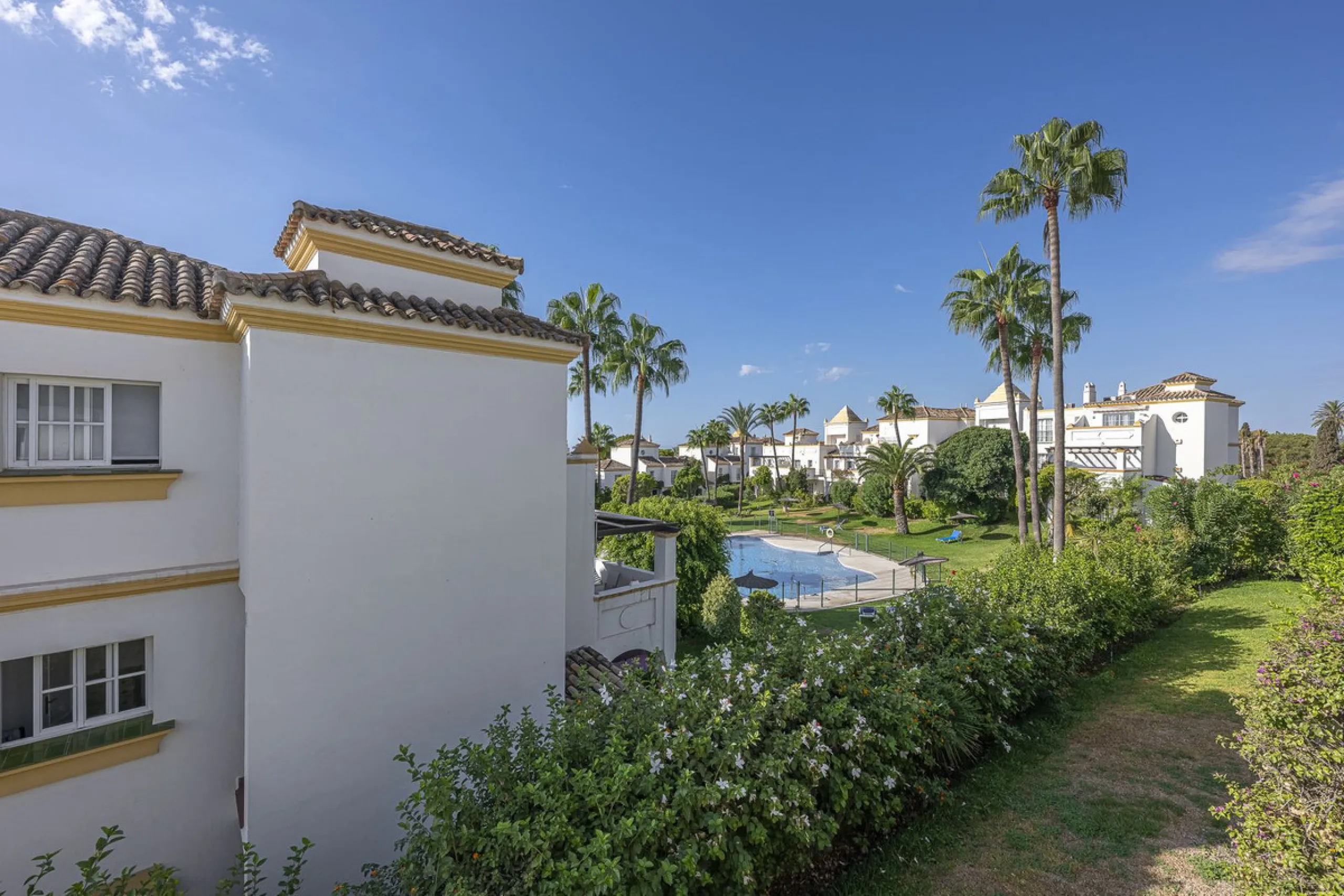 This stunning semi-detached villa is located in a traditional Andalusian development on the New Golden Mile. It is ideally located a short drive from Puerto Banús, with the beach just a short walk away.