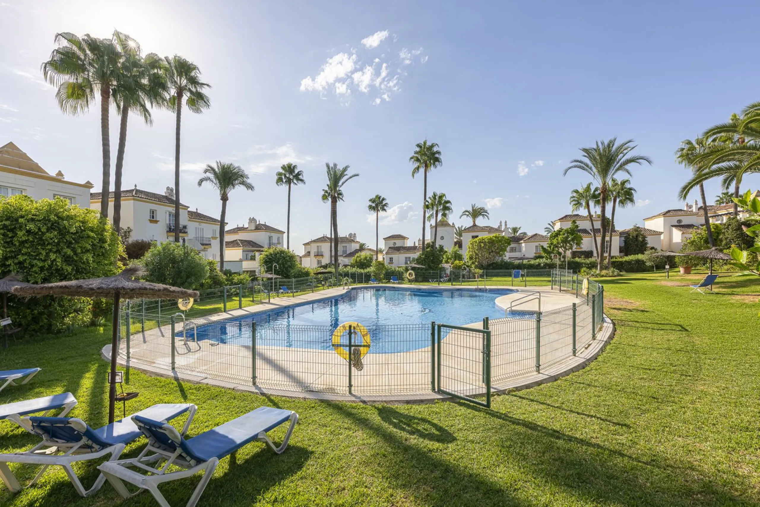 This stunning semi-detached villa is located in a traditional Andalusian development on the New Golden Mile. It is ideally located a short drive from Puerto Banús, with the beach just a short walk away.