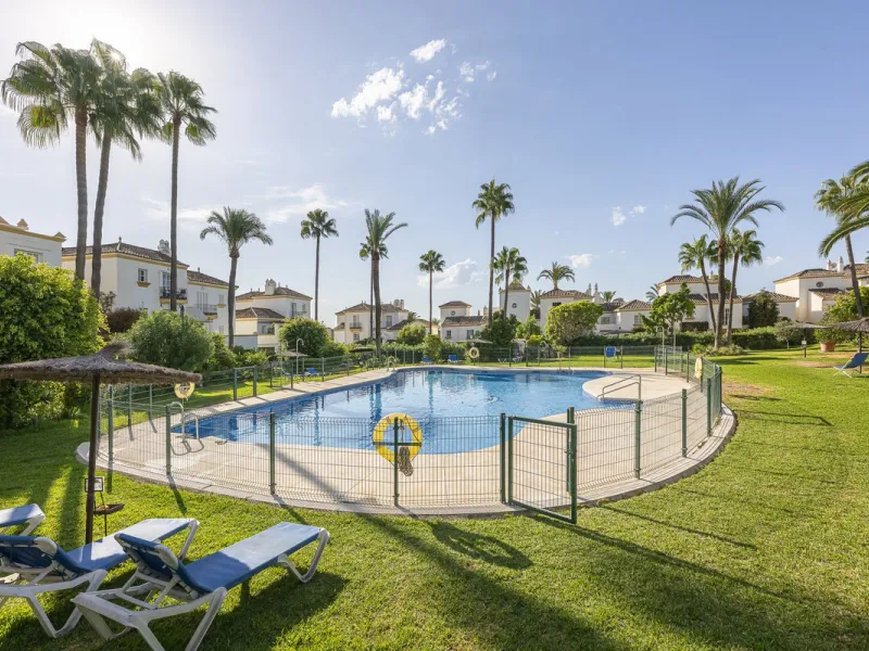 This stunning semi-detached villa is located in a traditional Andalusian development on the New Golden Mile. It is ideally located a short drive from Puerto Banús, with the beach just a short walk away.