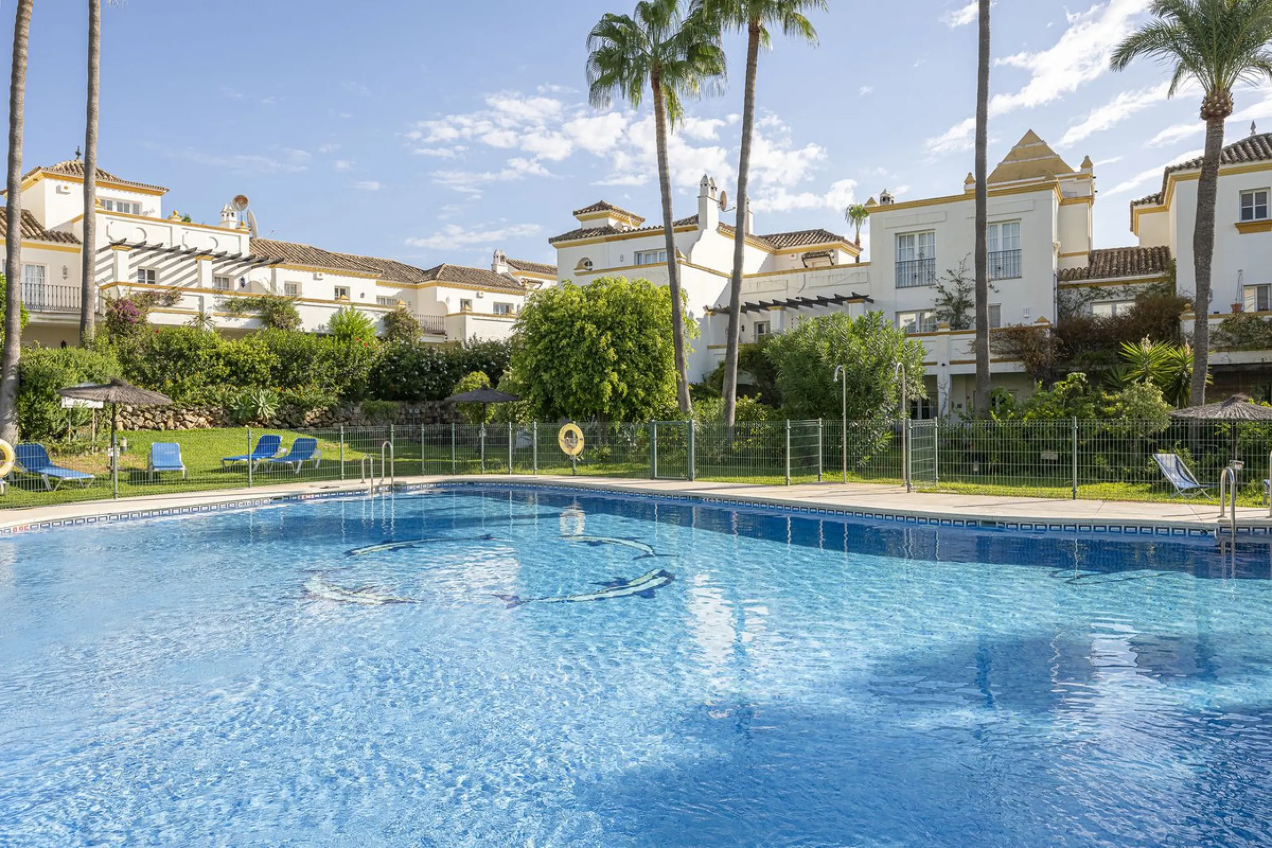 This stunning semi-detached villa is located in a traditional Andalusian development on the New Golden Mile. It is ideally located a short drive from Puerto Banús, with the beach just a short walk away.