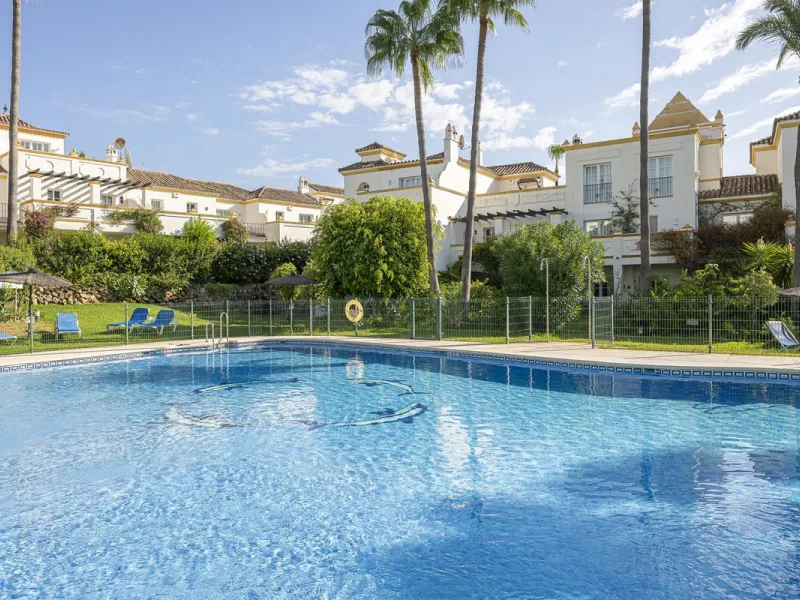 This stunning semi-detached villa is located in a traditional Andalusian development on the New Golden Mile. It is ideally located a short drive from Puerto Banús, with the beach just a short walk away.