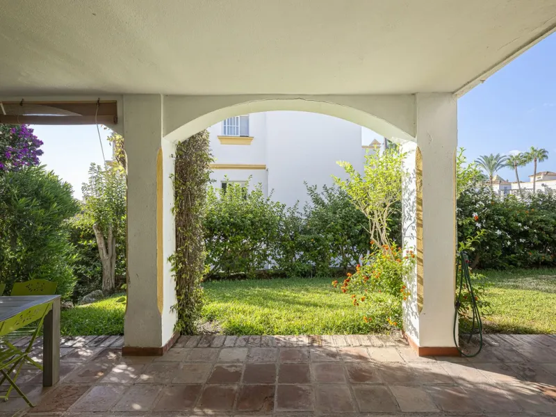 This stunning semi-detached villa is located in a traditional Andalusian development on the New Golden Mile. It is ideally located a short drive from Puerto Banús, with the beach just a short walk away.