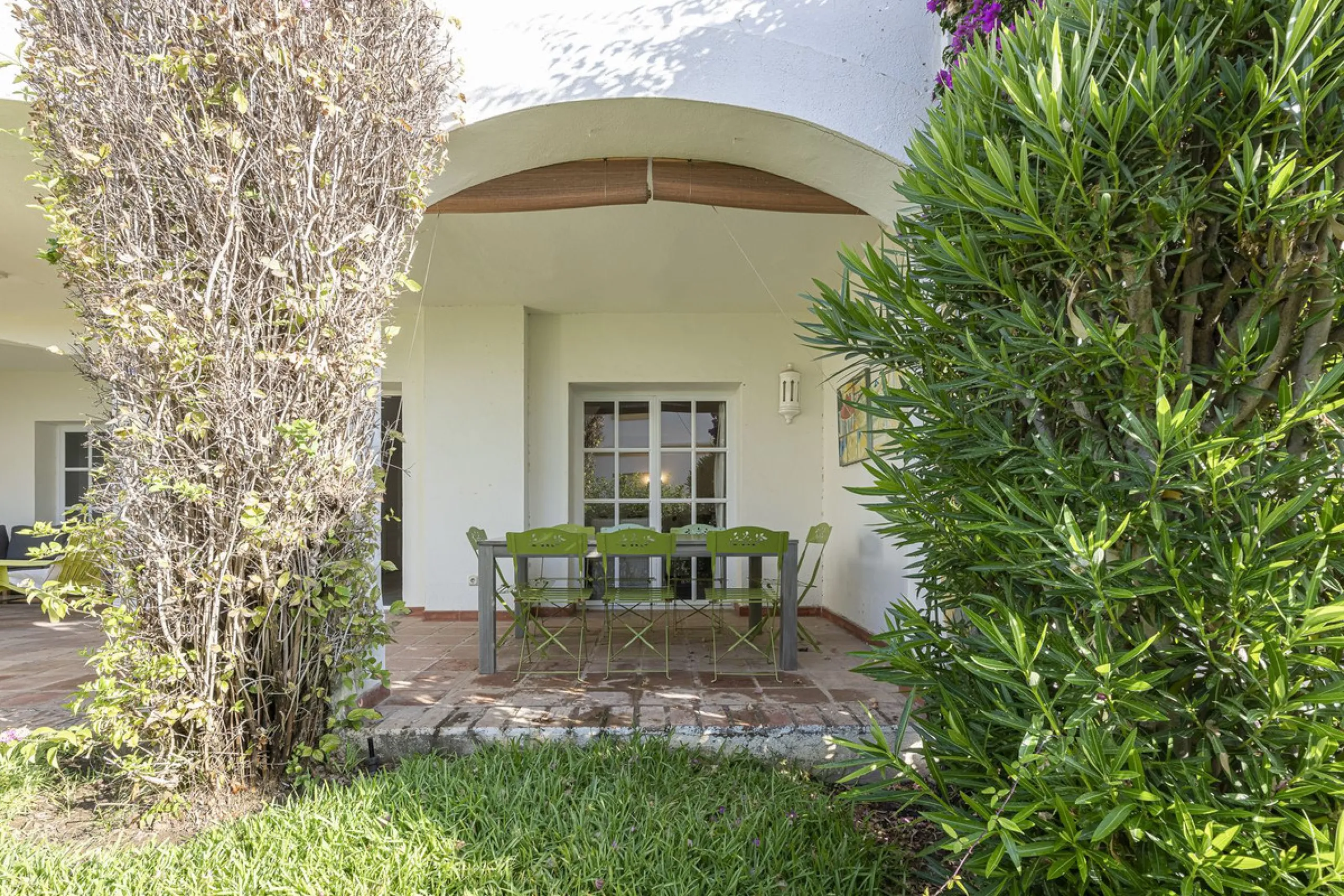 This stunning semi-detached villa is located in a traditional Andalusian development on the New Golden Mile. It is ideally located a short drive from Puerto Banús, with the beach just a short walk away.