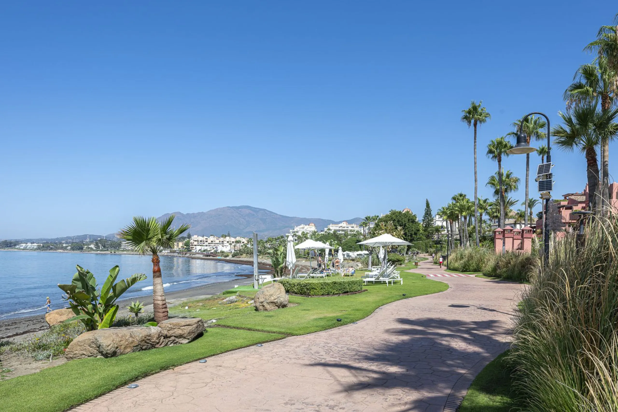 This stunning semi-detached villa is located in a traditional Andalusian development on the New Golden Mile. It is ideally located a short drive from Puerto Banús, with the beach just a short walk away.