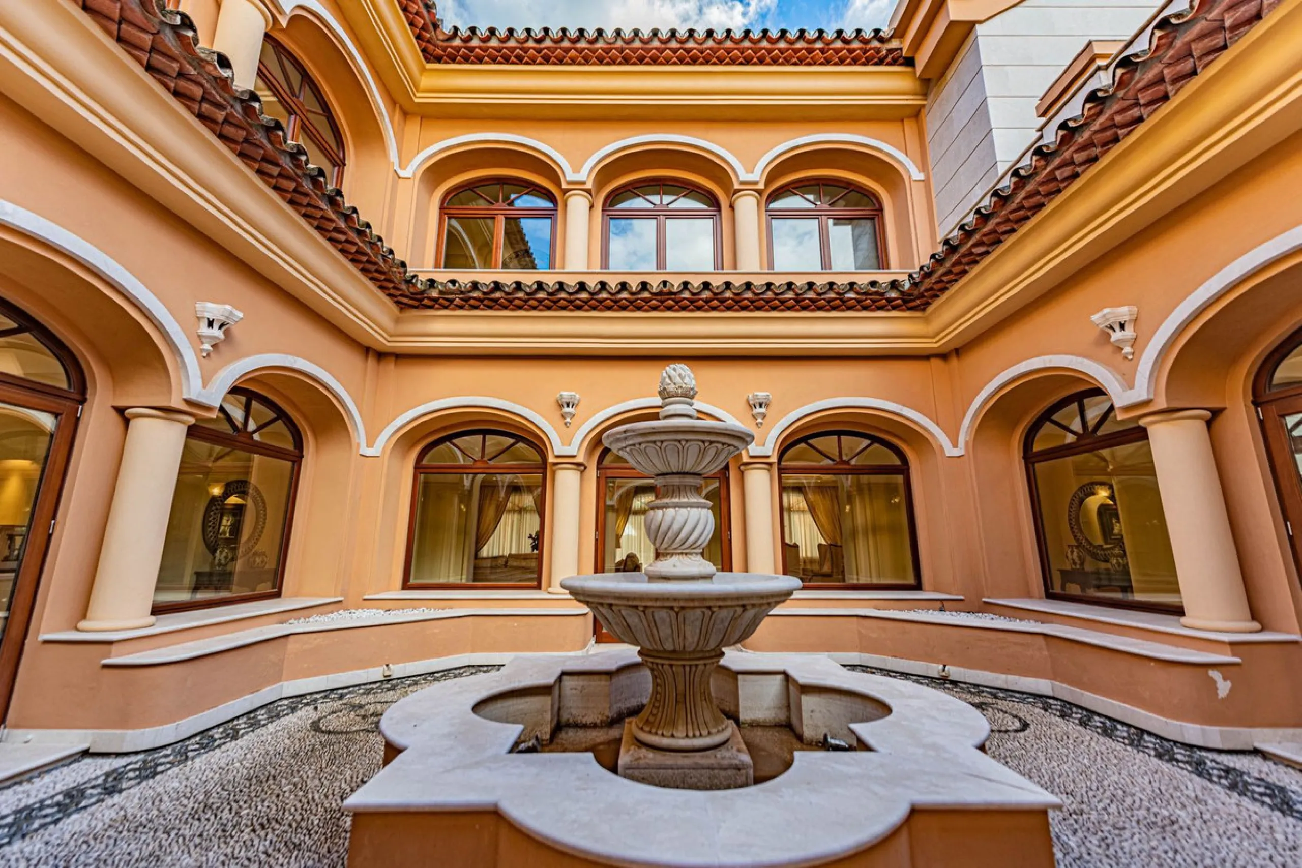 Luxury andalusian style villa that resides magnificently in one of the most prestigious and sought-after urbanizations in Marbella, Guadalmina Baja, only 100 meters from the beach and 5 minutes from Puerto Banus. The highest quality materials have been us
