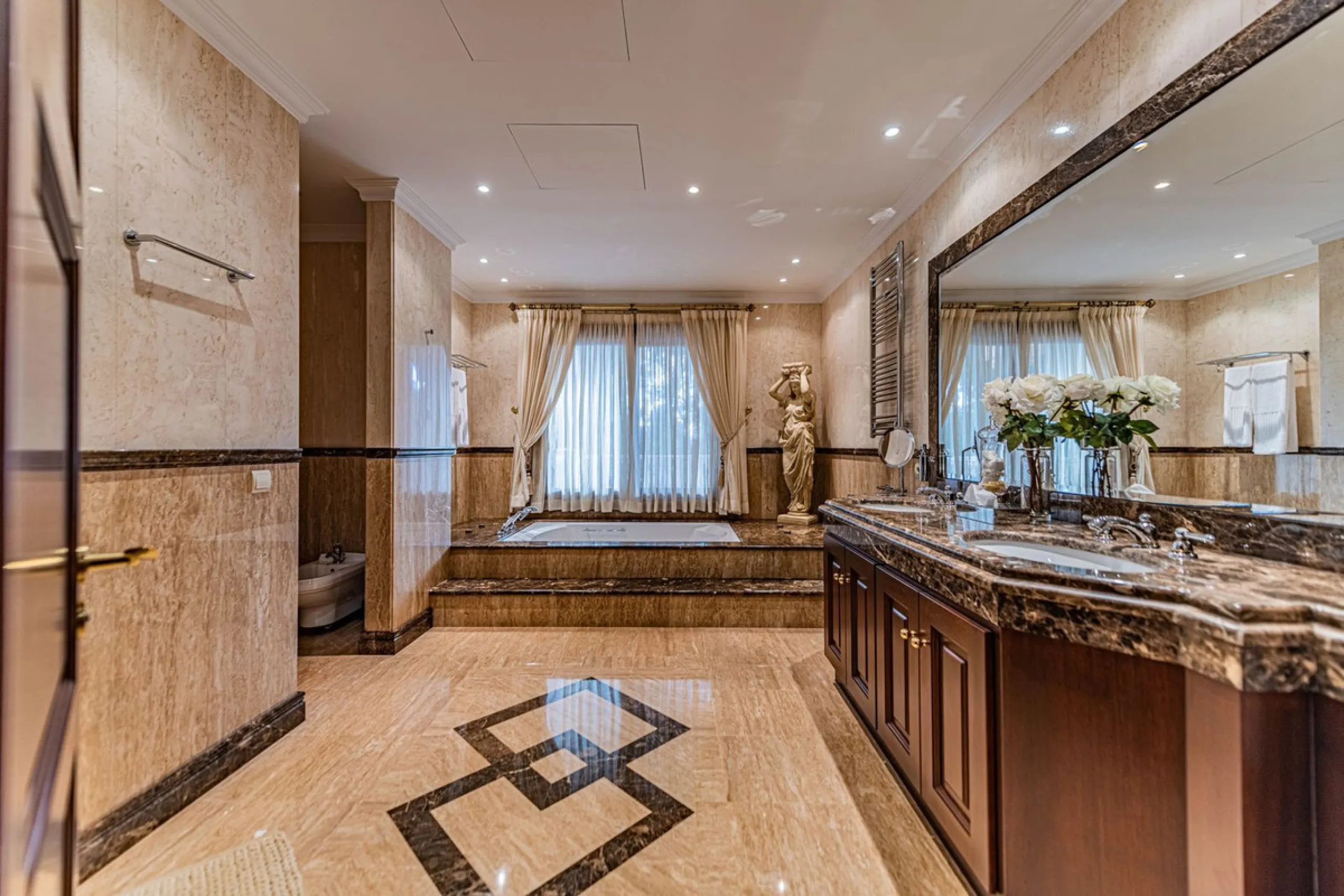 Luxury andalusian style villa that resides magnificently in one of the most prestigious and sought-after urbanizations in Marbella, Guadalmina Baja, only 100 meters from the beach and 5 minutes from Puerto Banus. The highest quality materials have been us