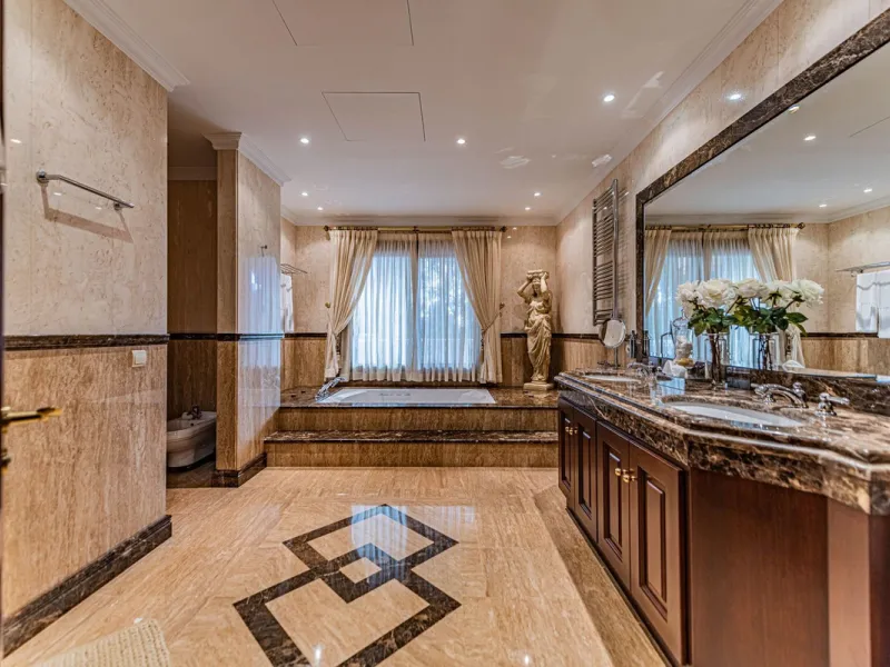 Luxury andalusian style villa that resides magnificently in one of the most prestigious and sought-after urbanizations in Marbella, Guadalmina Baja, only 100 meters from the beach and 5 minutes from Puerto Banus. The highest quality materials have been us