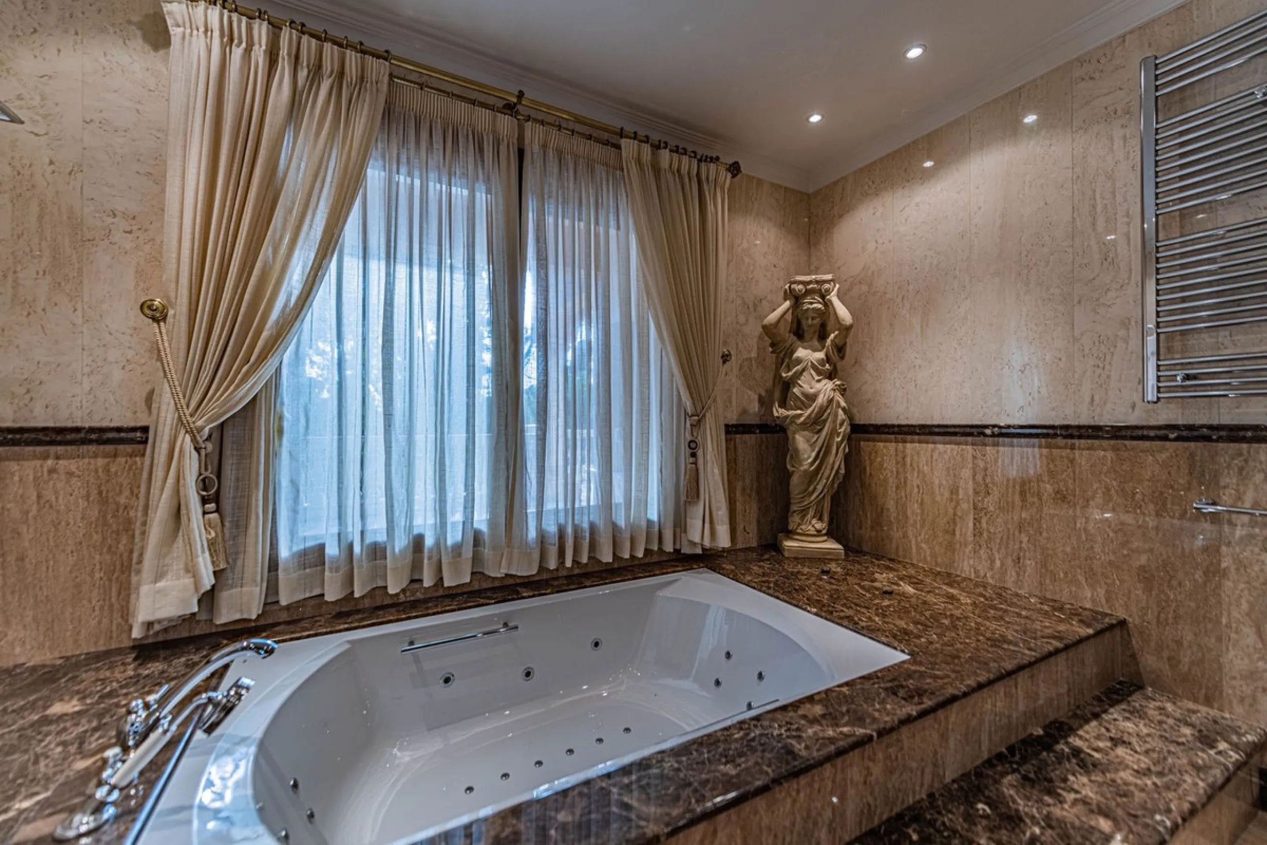 Luxury andalusian style villa that resides magnificently in one of the most prestigious and sought-after urbanizations in Marbella, Guadalmina Baja, only 100 meters from the beach and 5 minutes from Puerto Banus. The highest quality materials have been us