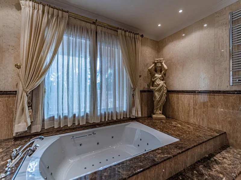 Luxury andalusian style villa that resides magnificently in one of the most prestigious and sought-after urbanizations in Marbella, Guadalmina Baja, only 100 meters from the beach and 5 minutes from Puerto Banus. The highest quality materials have been us
