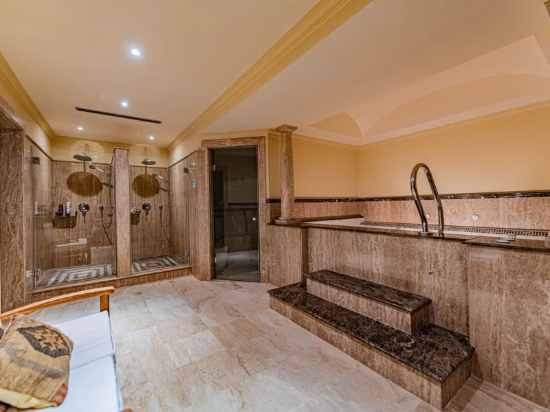 Luxury andalusian style villa that resides magnificently in one of the most prestigious and sought-after urbanizations in Marbella, Guadalmina Baja, only 100 meters from the beach and 5 minutes from Puerto Banus. The highest quality materials have been us