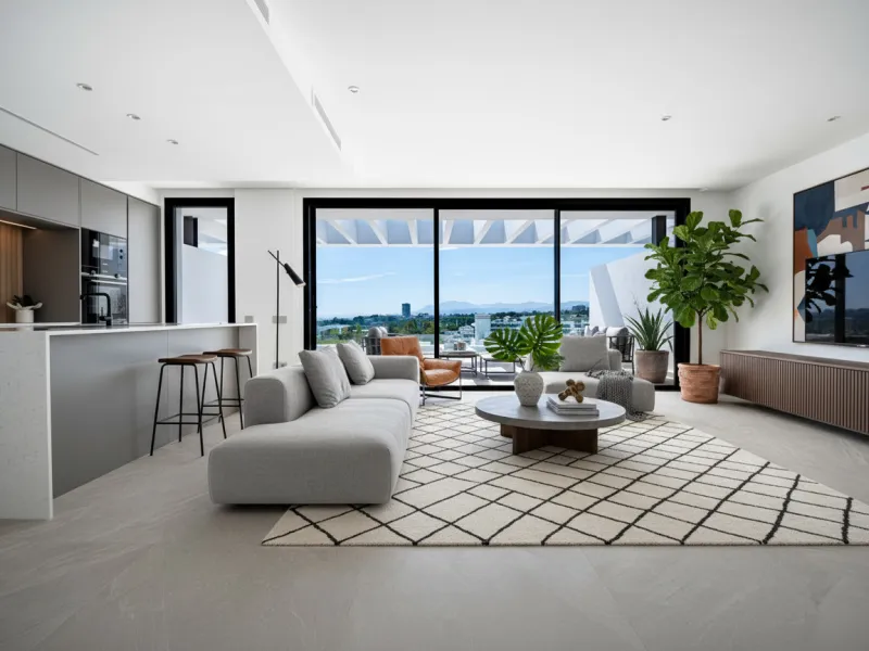 Penthouse Alma is a brand-new duplex home in a secure gated community in Marbella East. It has two ensuite bedrooms, a guest bathroom, and an open-plan living space that connects the kitchen, dining, and lounge areas. Floor-to-ceiling windows fill the hom