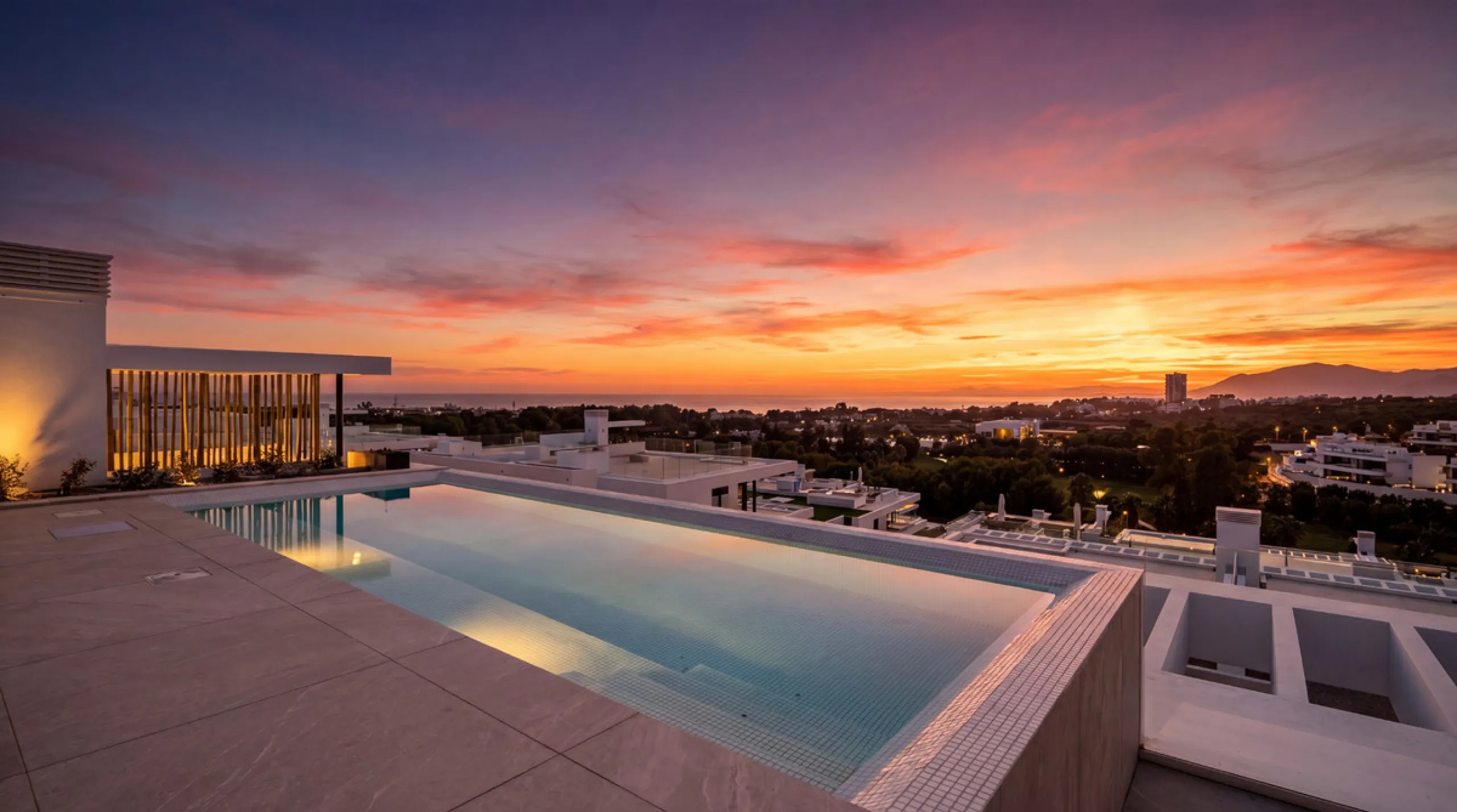 Penthouse Alma is a brand-new duplex home in a secure gated community in Marbella East. It has two ensuite bedrooms, a guest bathroom, and an open-plan living space that connects the kitchen, dining, and lounge areas. Floor-to-ceiling windows fill the hom