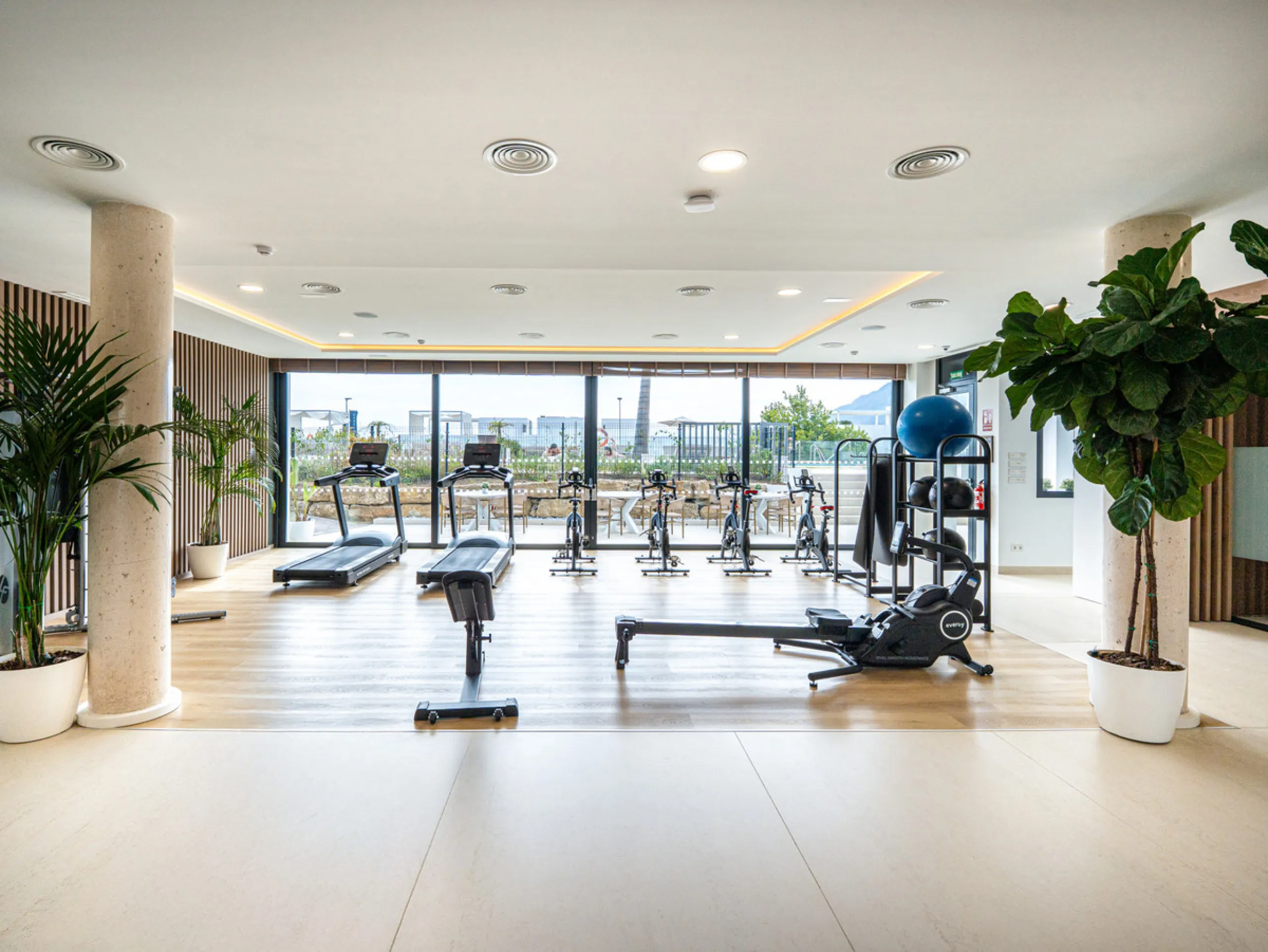 Penthouse Alma is a brand-new duplex home in a secure gated community in Marbella East. It has two ensuite bedrooms, a guest bathroom, and an open-plan living space that connects the kitchen, dining, and lounge areas. Floor-to-ceiling windows fill the hom