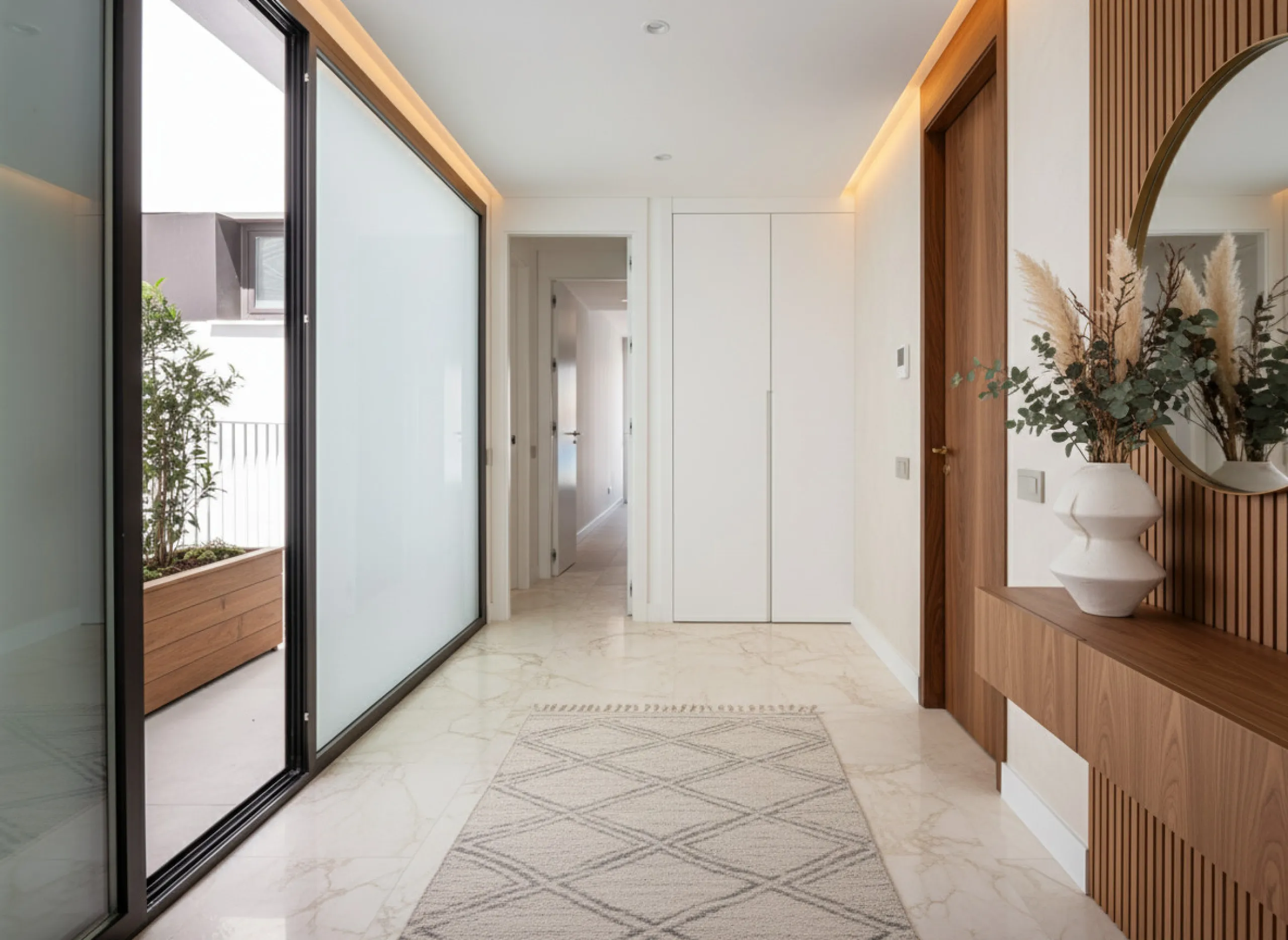 Penthouse Alma is a brand-new duplex home in a secure gated community in Marbella East. It has two ensuite bedrooms, a guest bathroom, and an open-plan living space that connects the kitchen, dining, and lounge areas. Floor-to-ceiling windows fill the hom