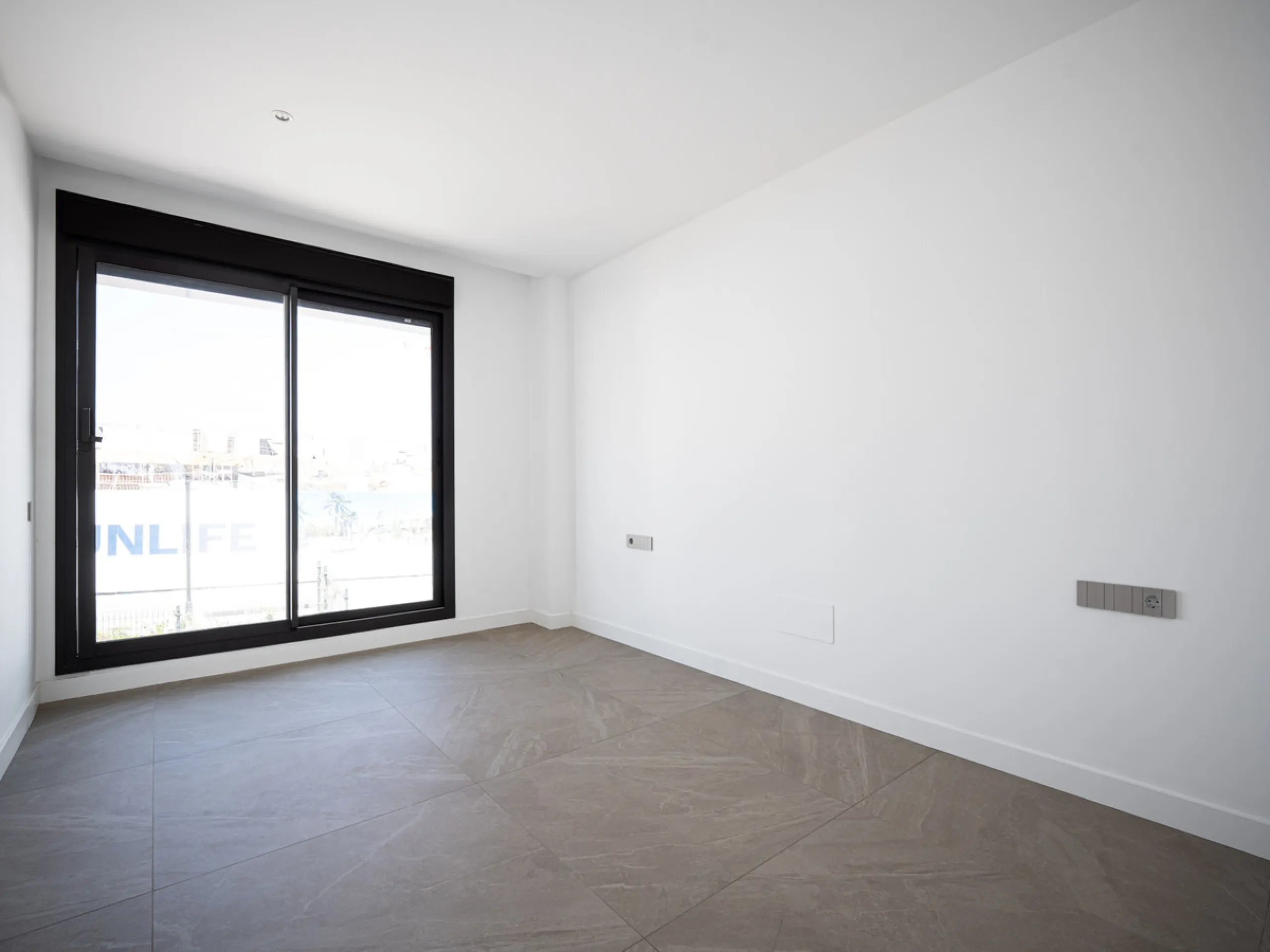 Penthouse Alma is a brand-new duplex home in a secure gated community in Marbella East. It has two ensuite bedrooms, a guest bathroom, and an open-plan living space that connects the kitchen, dining, and lounge areas. Floor-to-ceiling windows fill the hom