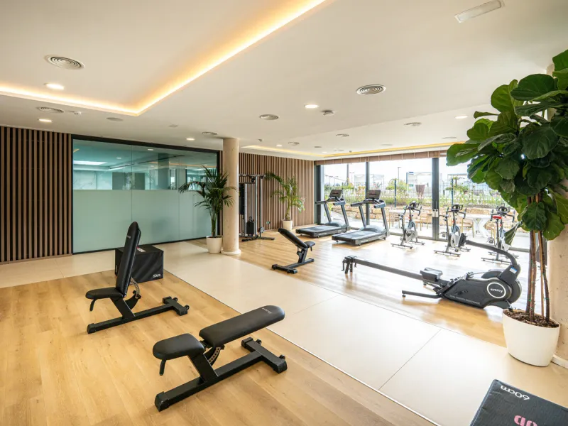 Penthouse Alma is a brand-new duplex home in a secure gated community in Marbella East. It has two ensuite bedrooms, a guest bathroom, and an open-plan living space that connects the kitchen, dining, and lounge areas. Floor-to-ceiling windows fill the hom