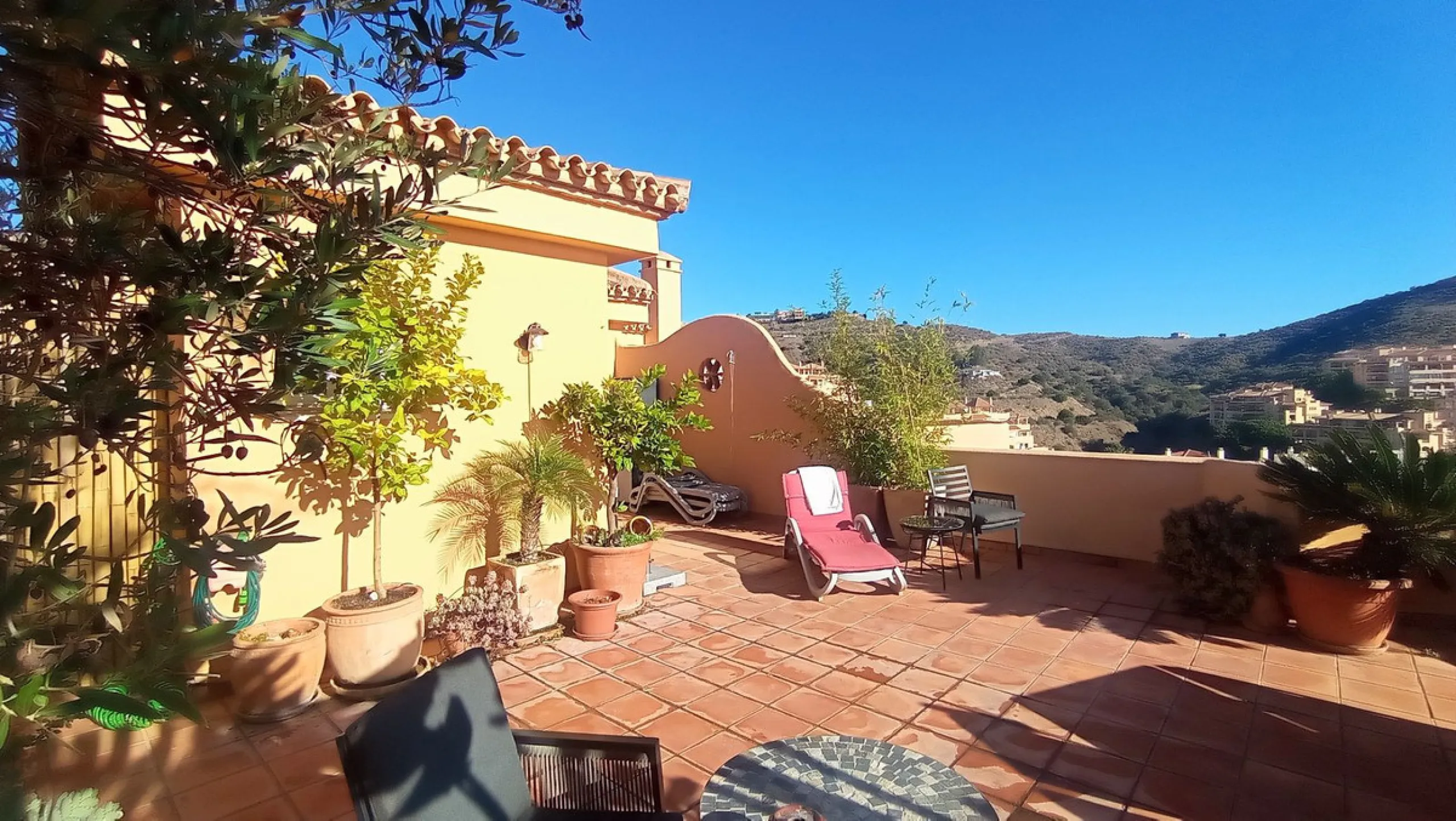 Stunning terraces with sea and mountain views. Over 60 square meters of covered and uncovered terraces. Immaculate two-story penthouse. Built-in interior staircase provides access to the upper level. The ground floor comprises two bedrooms and two full ba