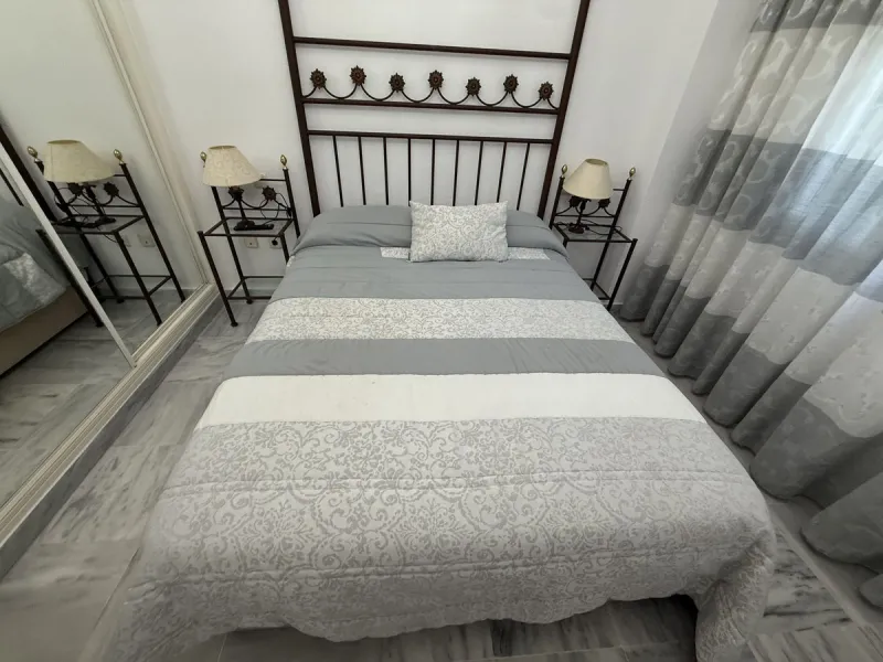 For sale apartment in the "Dama de Noche" complex, located on the ground floor with an underground parking space. It features two bedrooms, two bathrooms, a living room, a large terrace, and a private garden belonging to the apartment.