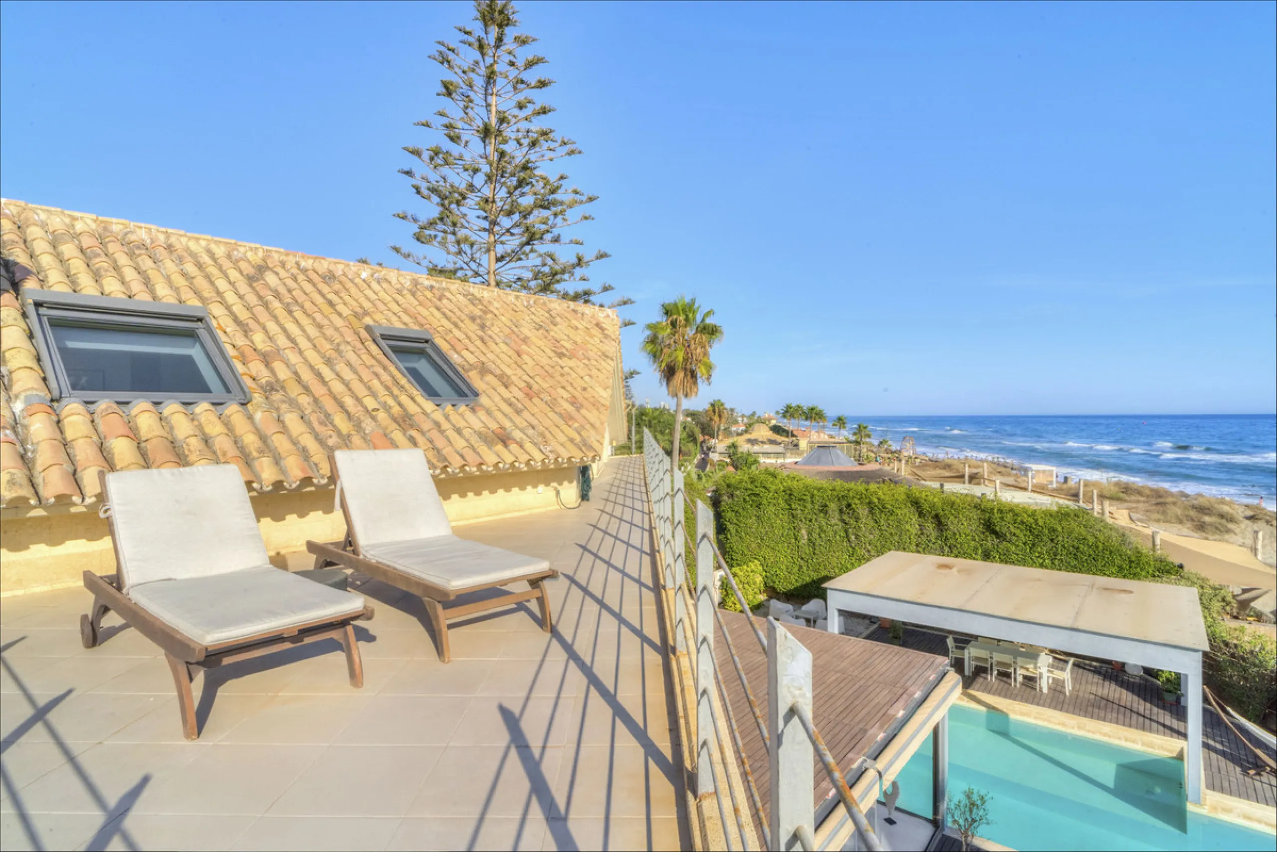 In one of the most sought-after locations along Marbella's coastline, this spectacular contemporary villa rises literally on the sand, offering a truly unique and unrivalled beachfront living experience.