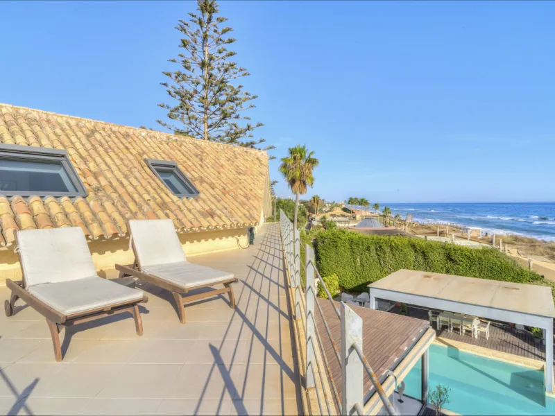 In one of the most sought-after locations along Marbella's coastline, this spectacular contemporary villa rises literally on the sand, offering a truly unique and unrivalled beachfront living experience.
