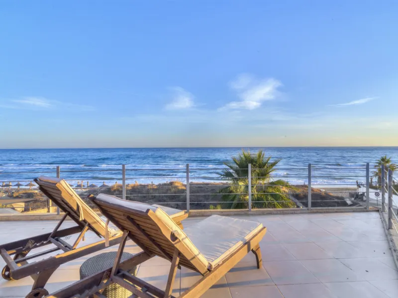 In one of the most sought-after locations along Marbella's coastline, this spectacular contemporary villa rises literally on the sand, offering a truly unique and unrivalled beachfront living experience.