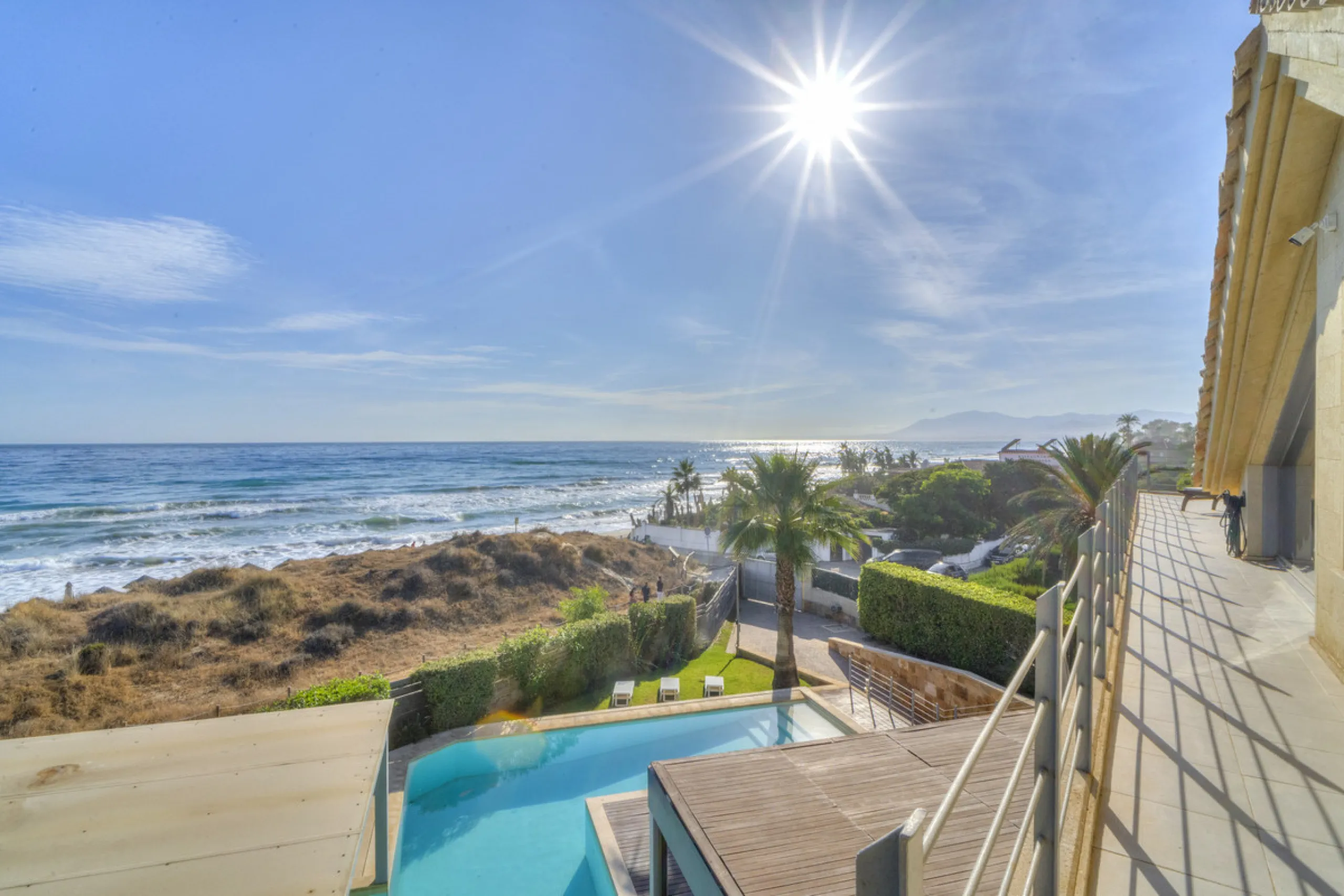 In one of the most sought-after locations along Marbella's coastline, this spectacular contemporary villa rises literally on the sand, offering a truly unique and unrivalled beachfront living experience.