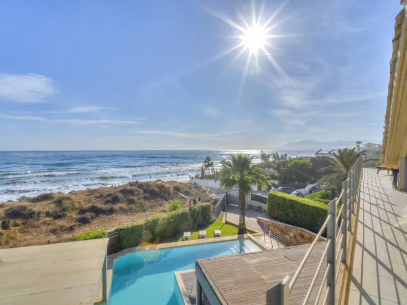 In one of the most sought-after locations along Marbella's coastline, this spectacular contemporary villa rises literally on the sand, offering a truly unique and unrivalled beachfront living experience.