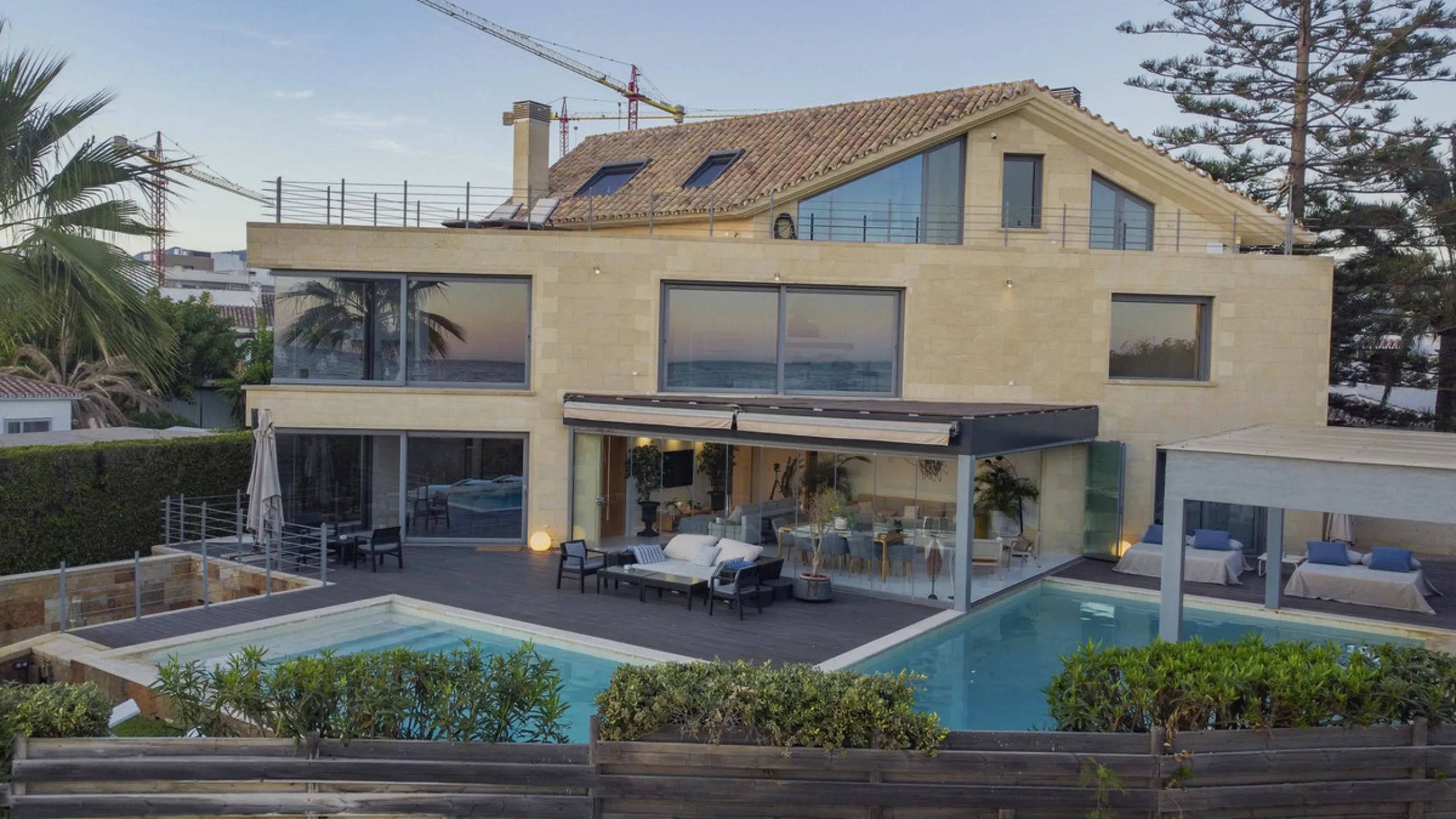 In one of the most sought-after locations along Marbella's coastline, this spectacular contemporary villa rises literally on the sand, offering a truly unique and unrivalled beachfront living experience.