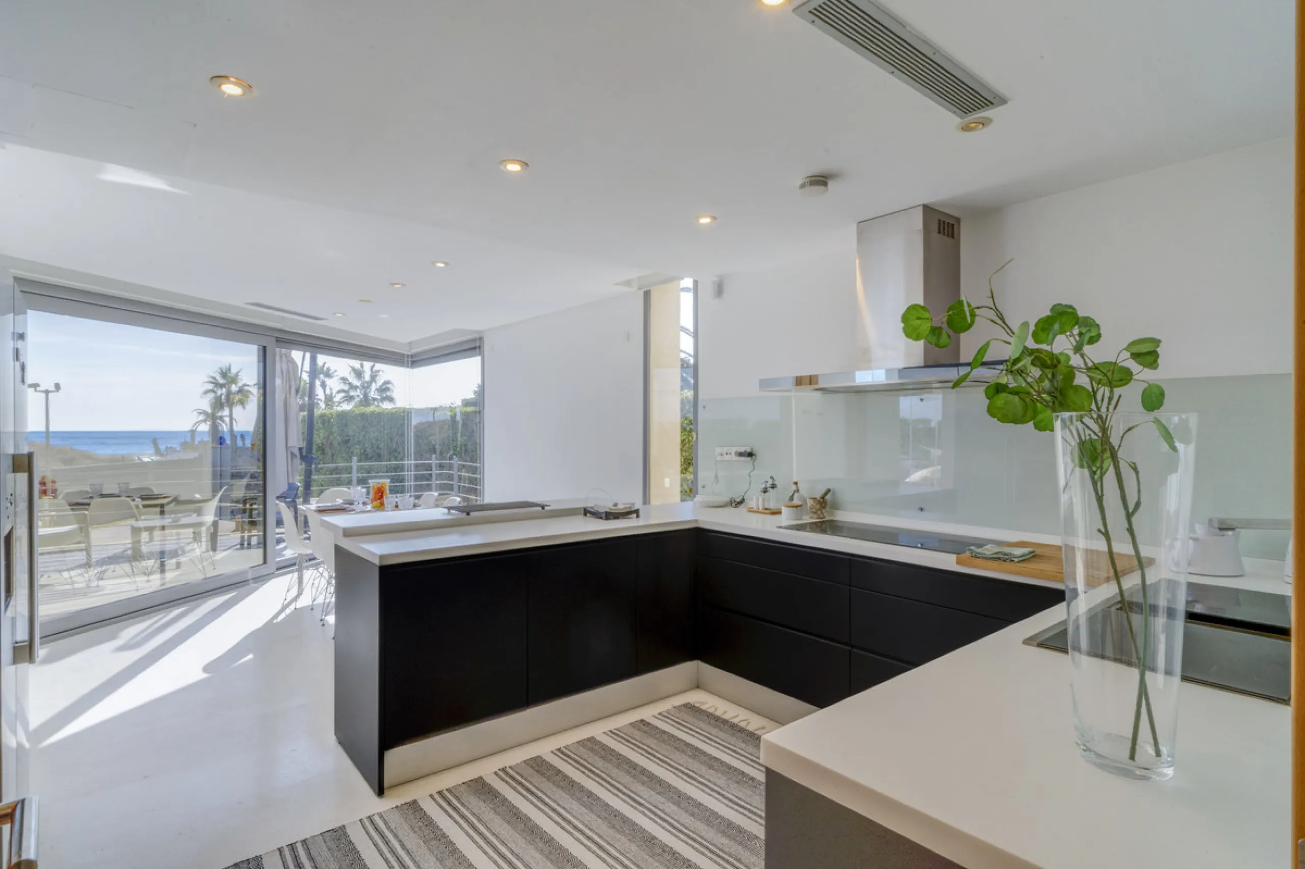 In one of the most sought-after locations along Marbella's coastline, this spectacular contemporary villa rises literally on the sand, offering a truly unique and unrivalled beachfront living experience.