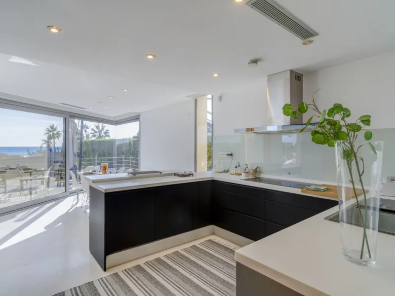 In one of the most sought-after locations along Marbella's coastline, this spectacular contemporary villa rises literally on the sand, offering a truly unique and unrivalled beachfront living experience.