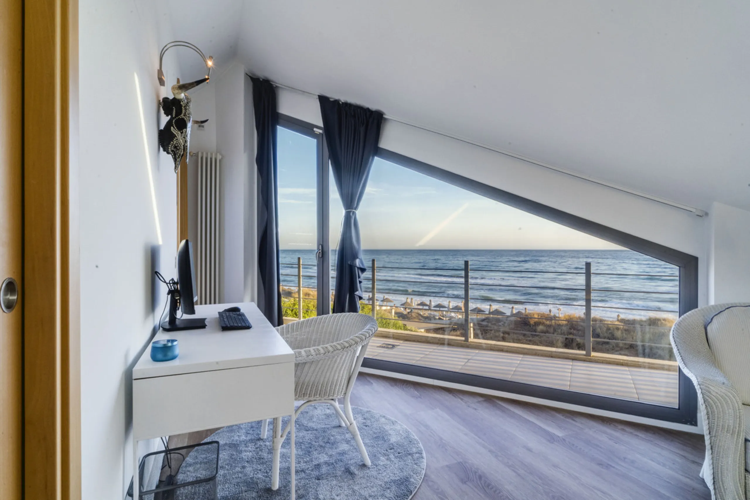 In one of the most sought-after locations along Marbella's coastline, this spectacular contemporary villa rises literally on the sand, offering a truly unique and unrivalled beachfront living experience.
