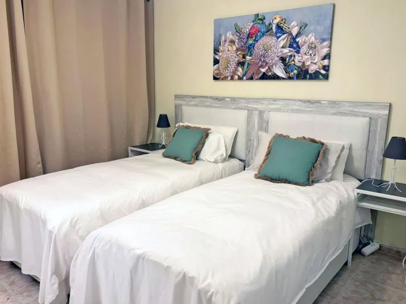 Discover this charming top-floor, 2-bedroom apartment perfectly situated in the sought-after community of El Presidente, Estepona. Bathed in natural light, the property boasts expansive open views over the large central pool and beautifully manicured trop
