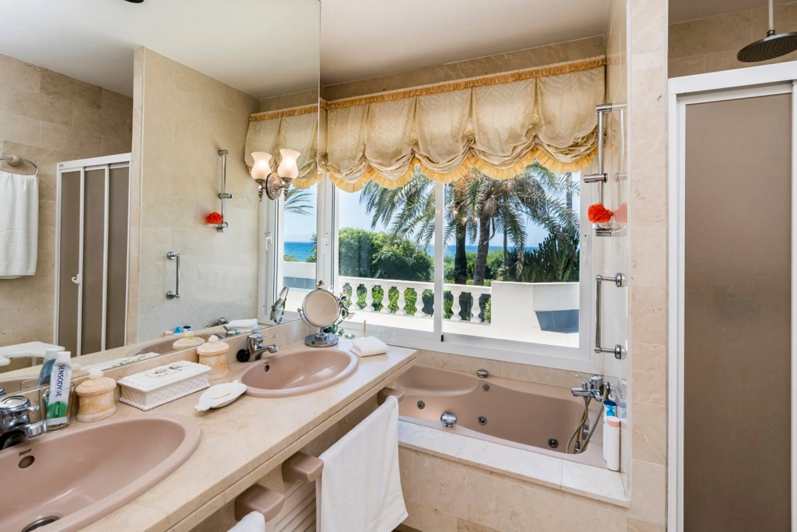 This remarkable beachfront villa, located adjacent to the renowned Nikki Beach in Elviria, East Marbella, offers an unparalleled living experience. Spread across two levels, the villa features four spacious bedrooms, each with its own en-suite bathroom, a