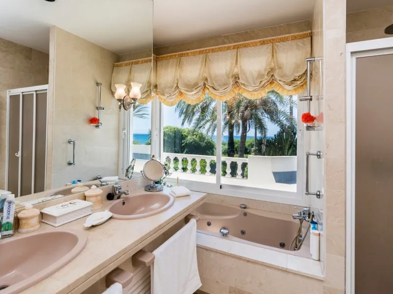 This remarkable beachfront villa, located adjacent to the renowned Nikki Beach in Elviria, East Marbella, offers an unparalleled living experience. Spread across two levels, the villa features four spacious bedrooms, each with its own en-suite bathroom, a