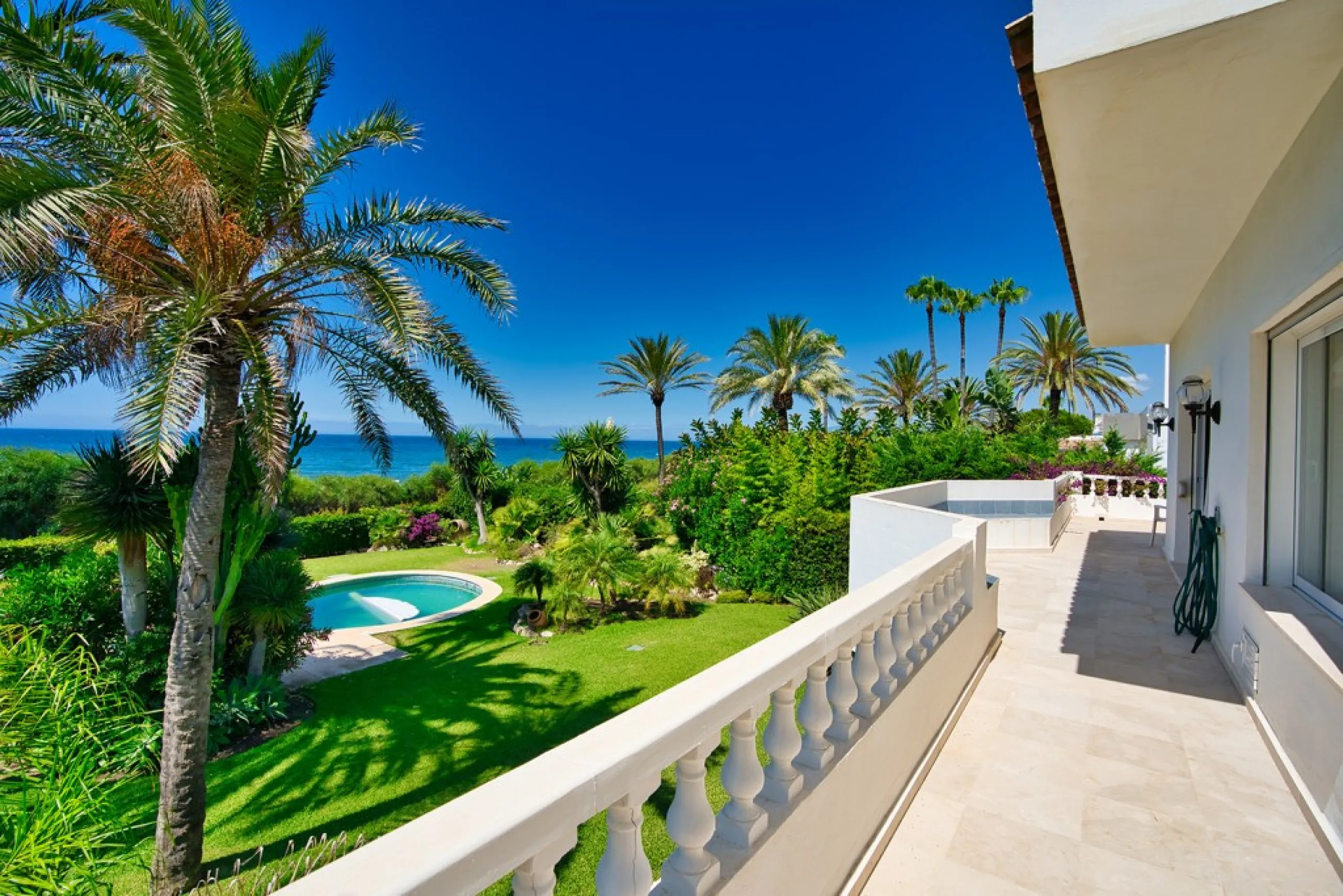 This remarkable beachfront villa, located adjacent to the renowned Nikki Beach in Elviria, East Marbella, offers an unparalleled living experience. Spread across two levels, the villa features four spacious bedrooms, each with its own en-suite bathroom, a