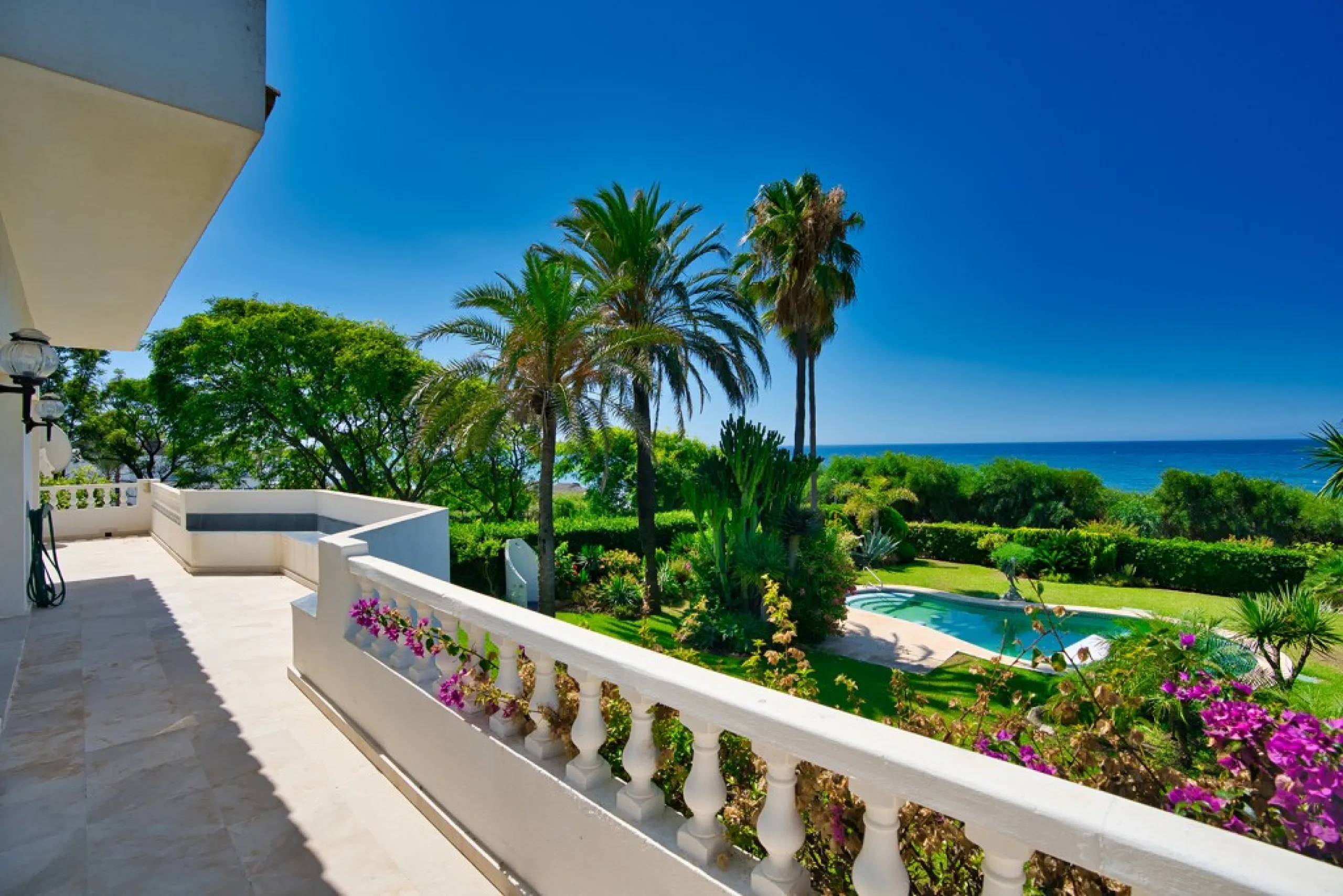 This remarkable beachfront villa, located adjacent to the renowned Nikki Beach in Elviria, East Marbella, offers an unparalleled living experience. Spread across two levels, the villa features four spacious bedrooms, each with its own en-suite bathroom, a