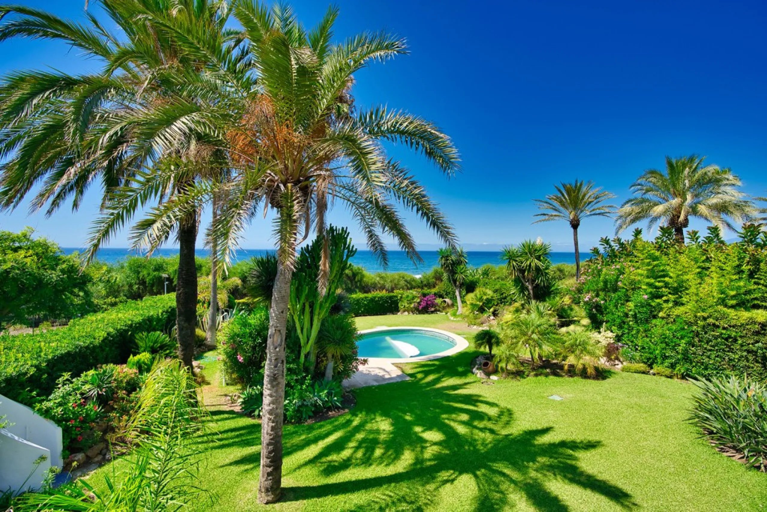 This remarkable beachfront villa, located adjacent to the renowned Nikki Beach in Elviria, East Marbella, offers an unparalleled living experience. Spread across two levels, the villa features four spacious bedrooms, each with its own en-suite bathroom, a