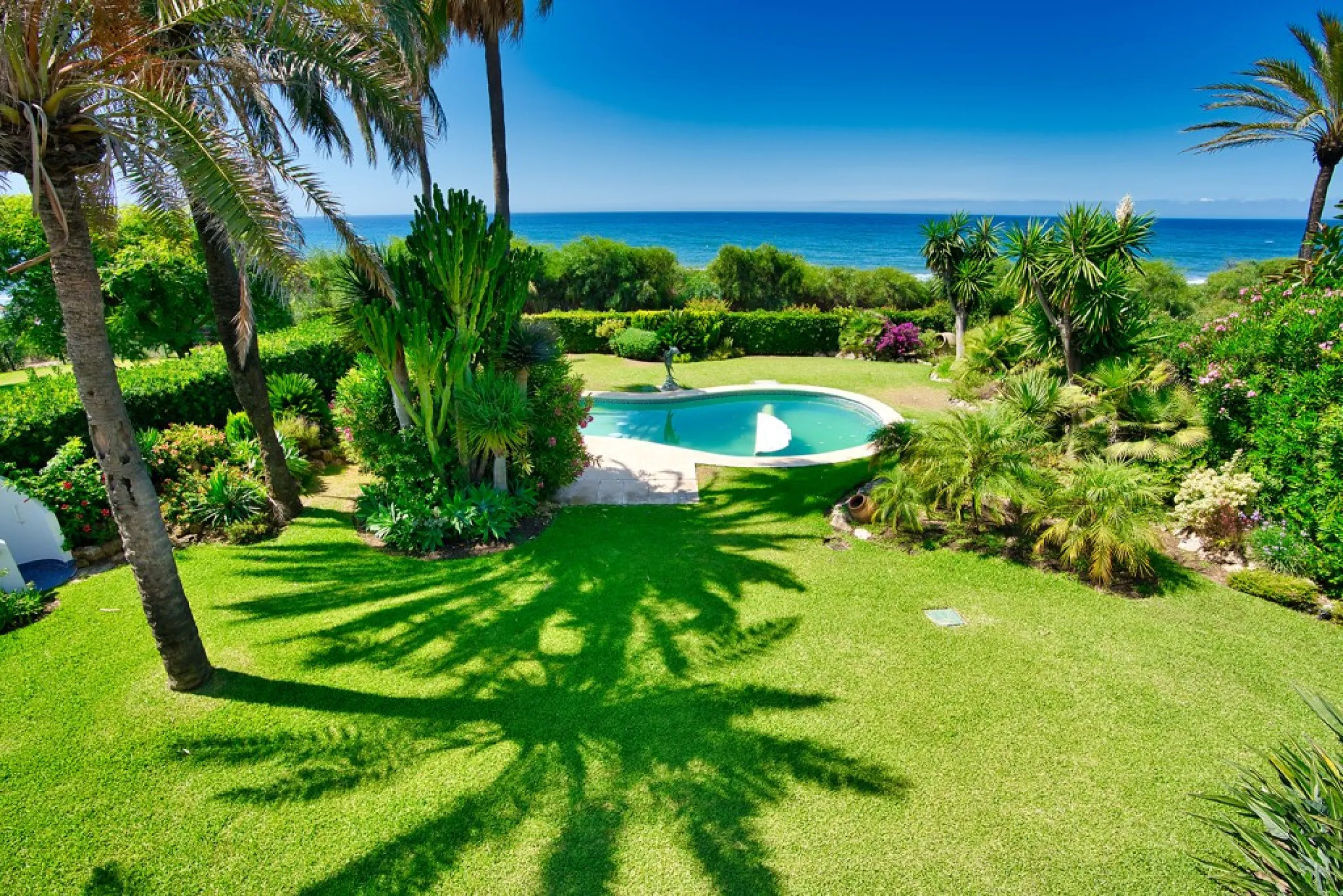 This remarkable beachfront villa, located adjacent to the renowned Nikki Beach in Elviria, East Marbella, offers an unparalleled living experience. Spread across two levels, the villa features four spacious bedrooms, each with its own en-suite bathroom, a
